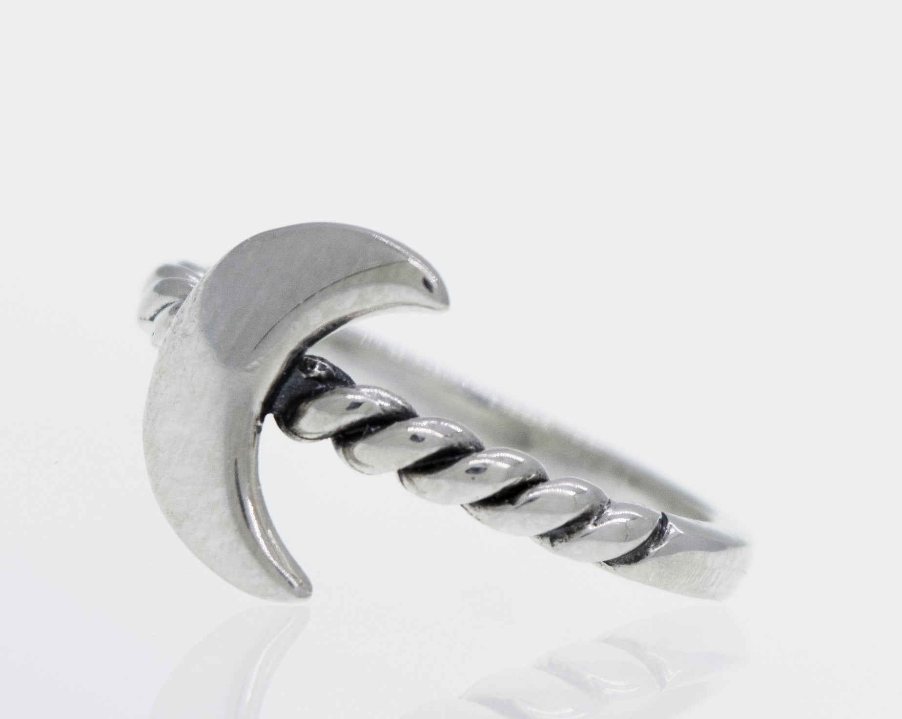 A minimalist Crescent Moon Ring With Rope Textured Band.