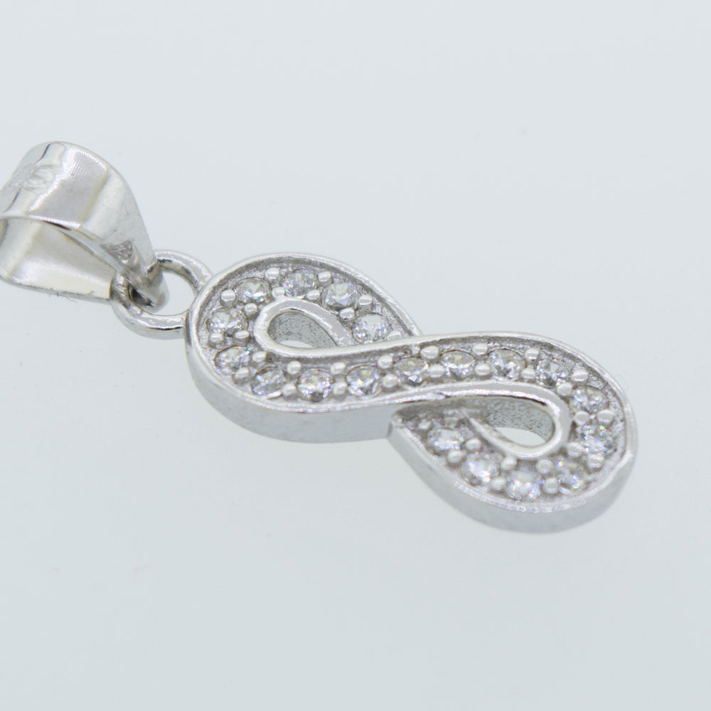 A Cubic Zirconia Infinity Pendant by Super Silver with diamonds and an infinity shape.