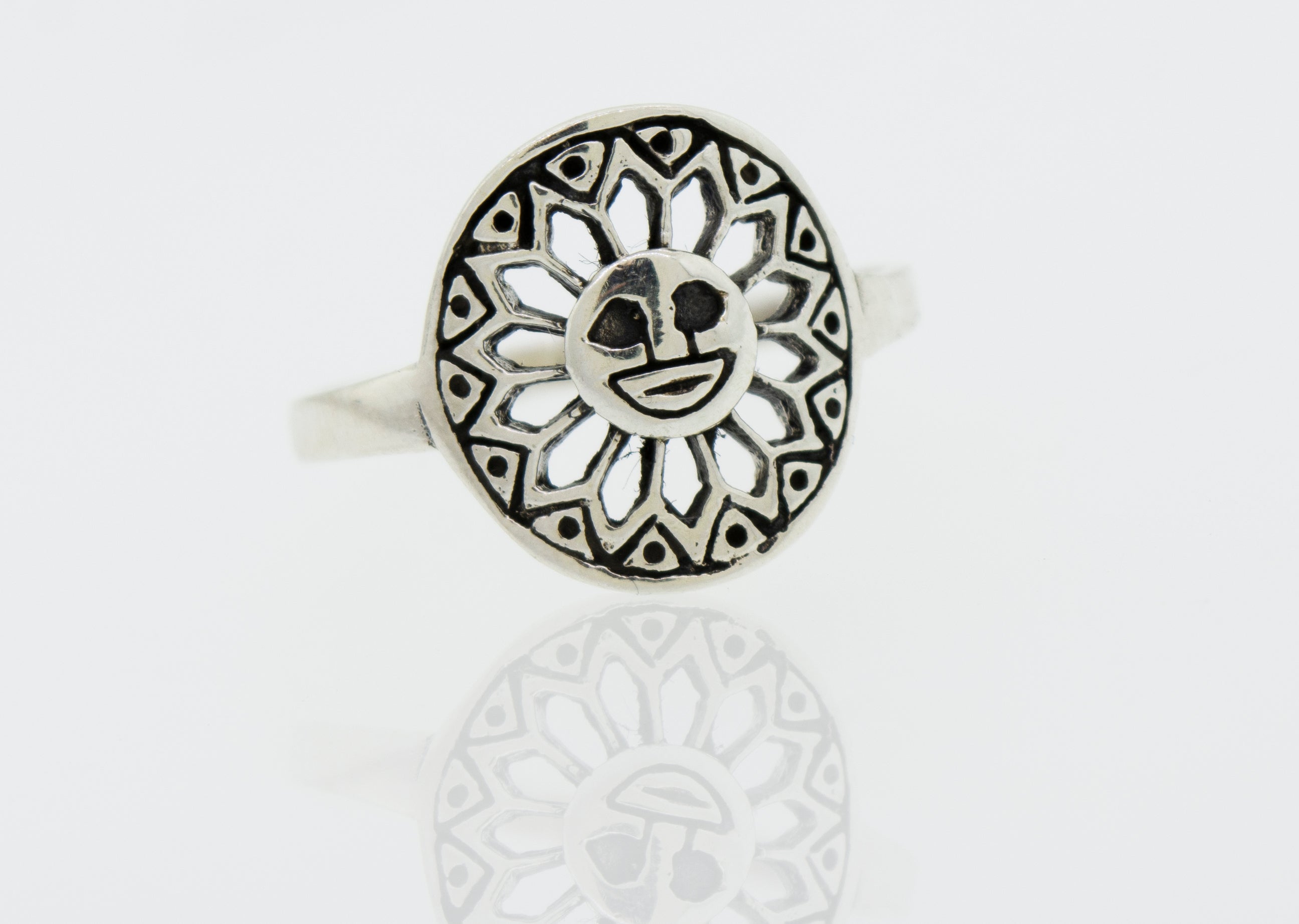 A Super Silver Silver Ring Sun With A Face with a sun design on it.