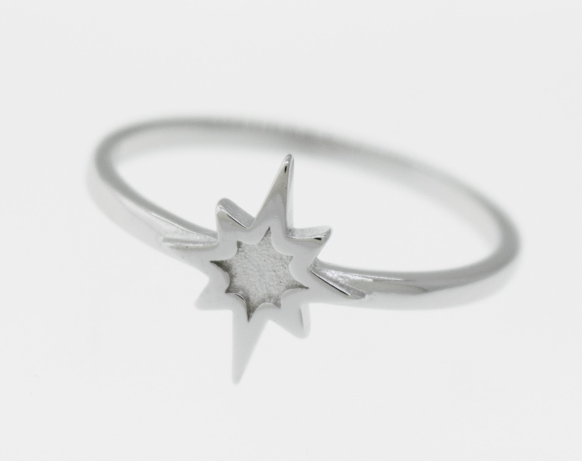A high polish Super Silver 925 sterling silver Twinkle Star Ring with a twinkle star in the middle.