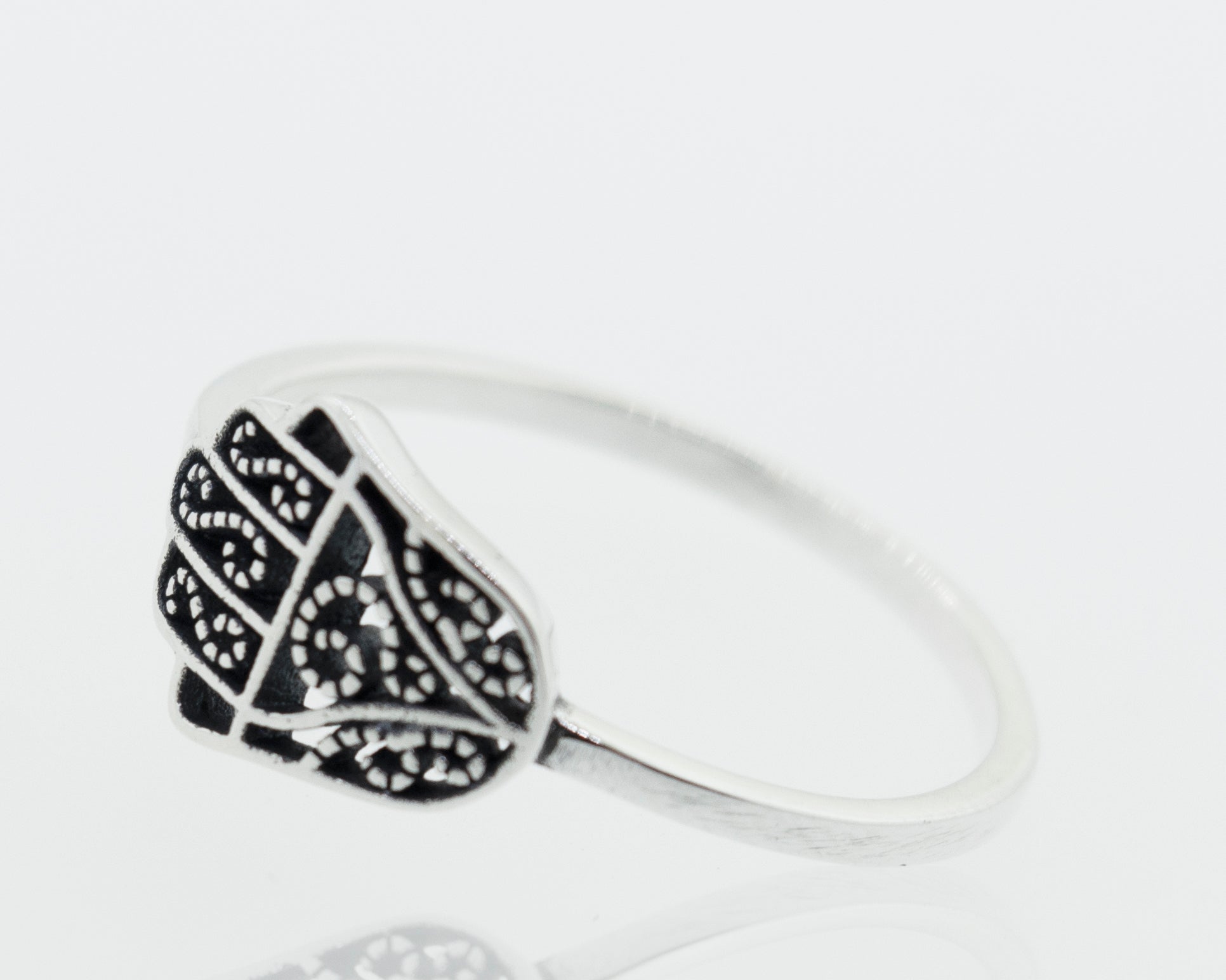 A Hamsa Ring with Filigree Design with intricate cultural designs.