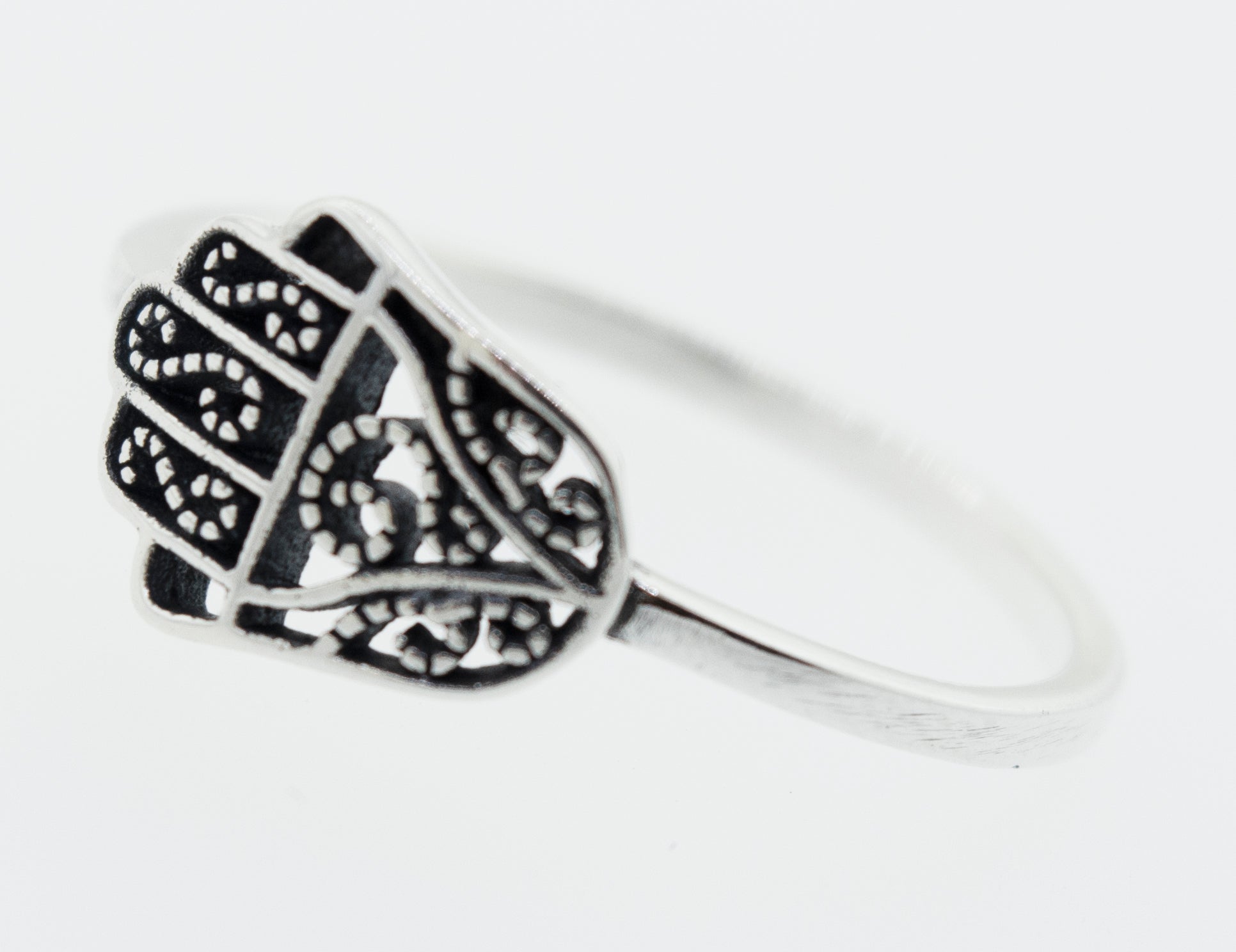 A cultural Hamsa Ring with filigree designs, representing Judaism.