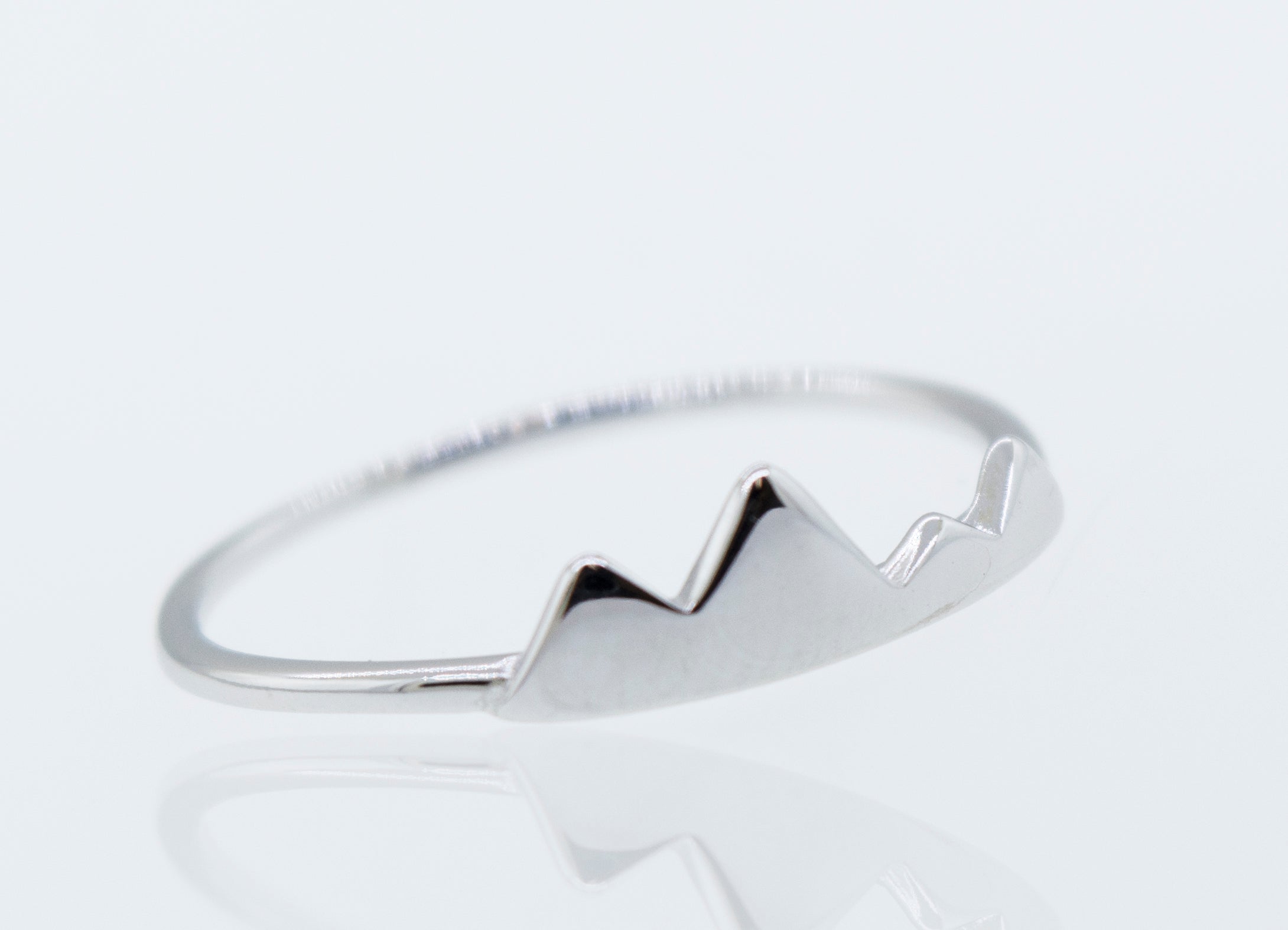A Super Silver Rhodium Plated Silver Mountains Ring with a mountain design.