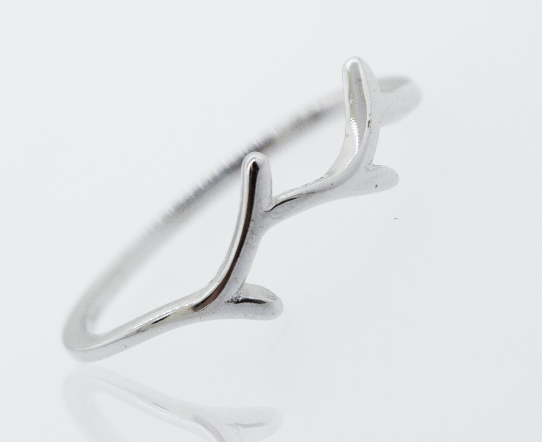 A Tree Branch Silver ring with antlers on it. (Brand Name: Super Silver)