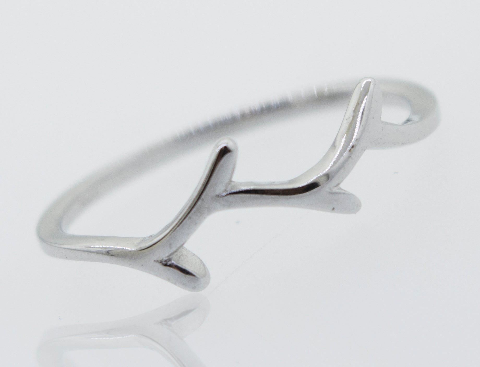 A Tree Branch Silver Ring with antlers on it, by Super Silver.
