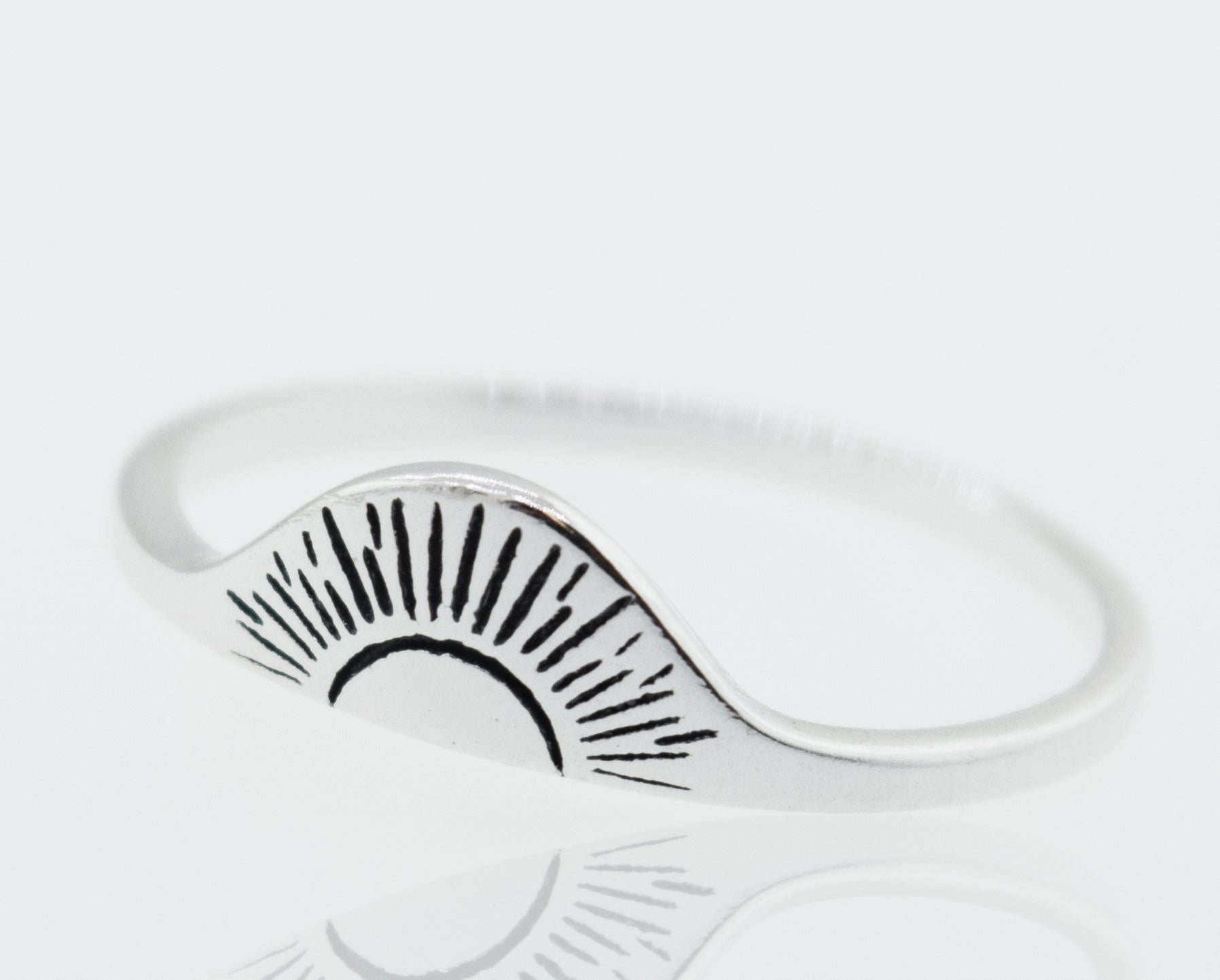 A Super Silver Sunrise Ring with a sunburst design, featuring a high shine finish.