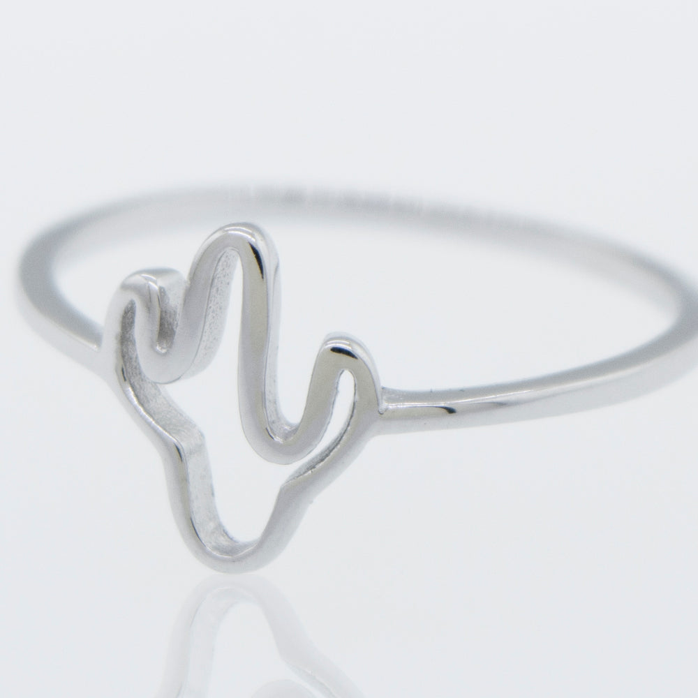 A high polish Super Silver Cactus Ring on a white surface.