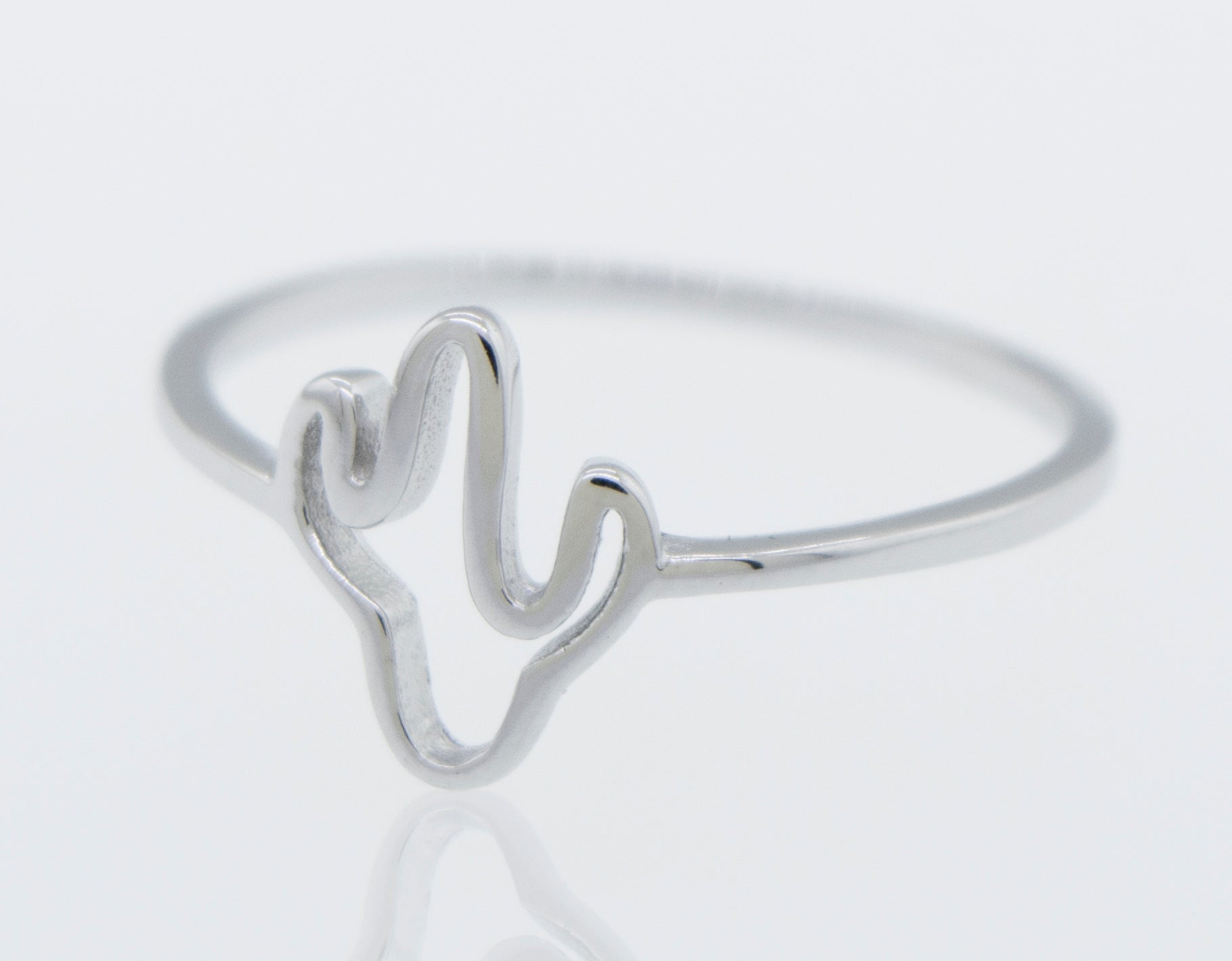 A high polish Super Silver Cactus Ring on a white surface.
