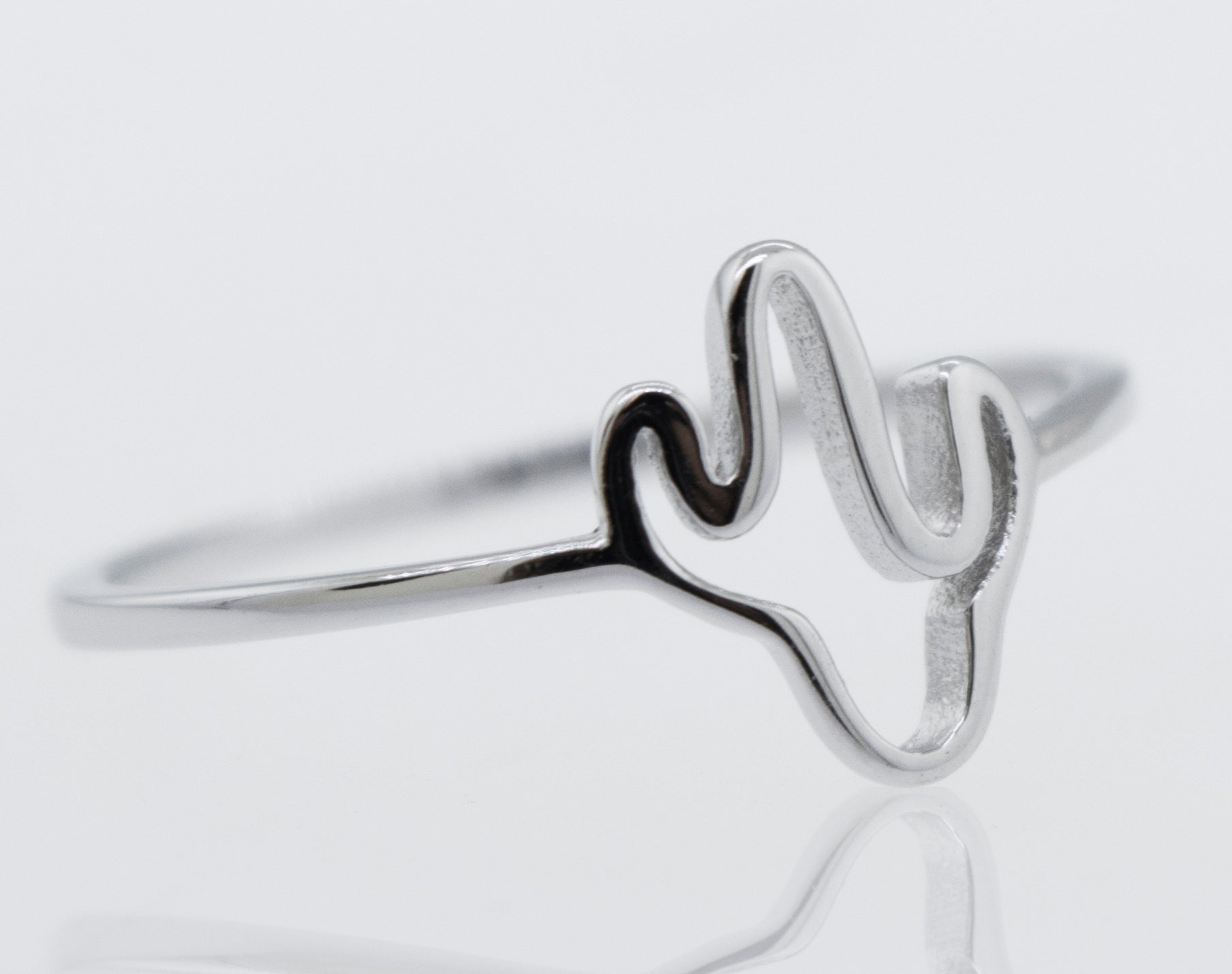 A high polish Super Silver Cactus Ring on a white surface.