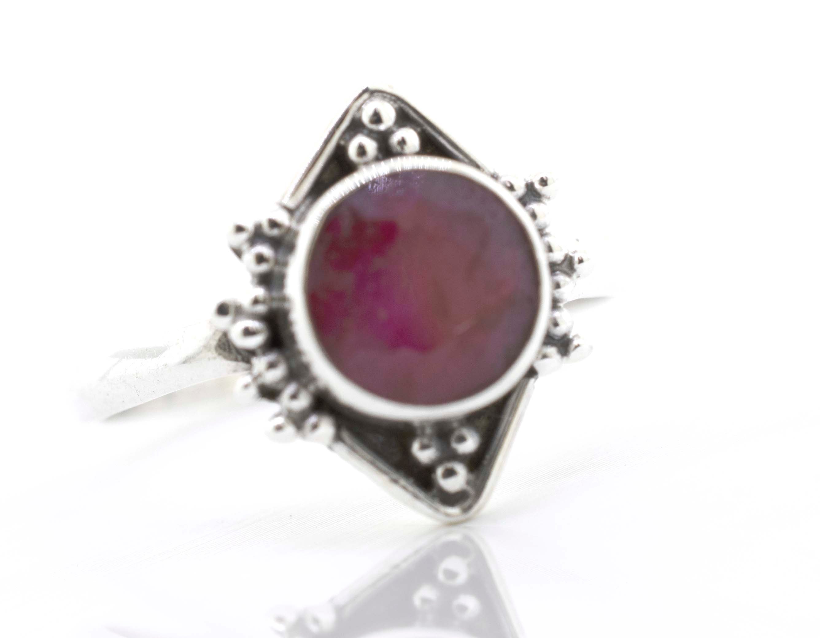 A Super Silver Round Gemstone Ring With Oxidized Diamond Shape Pattern.