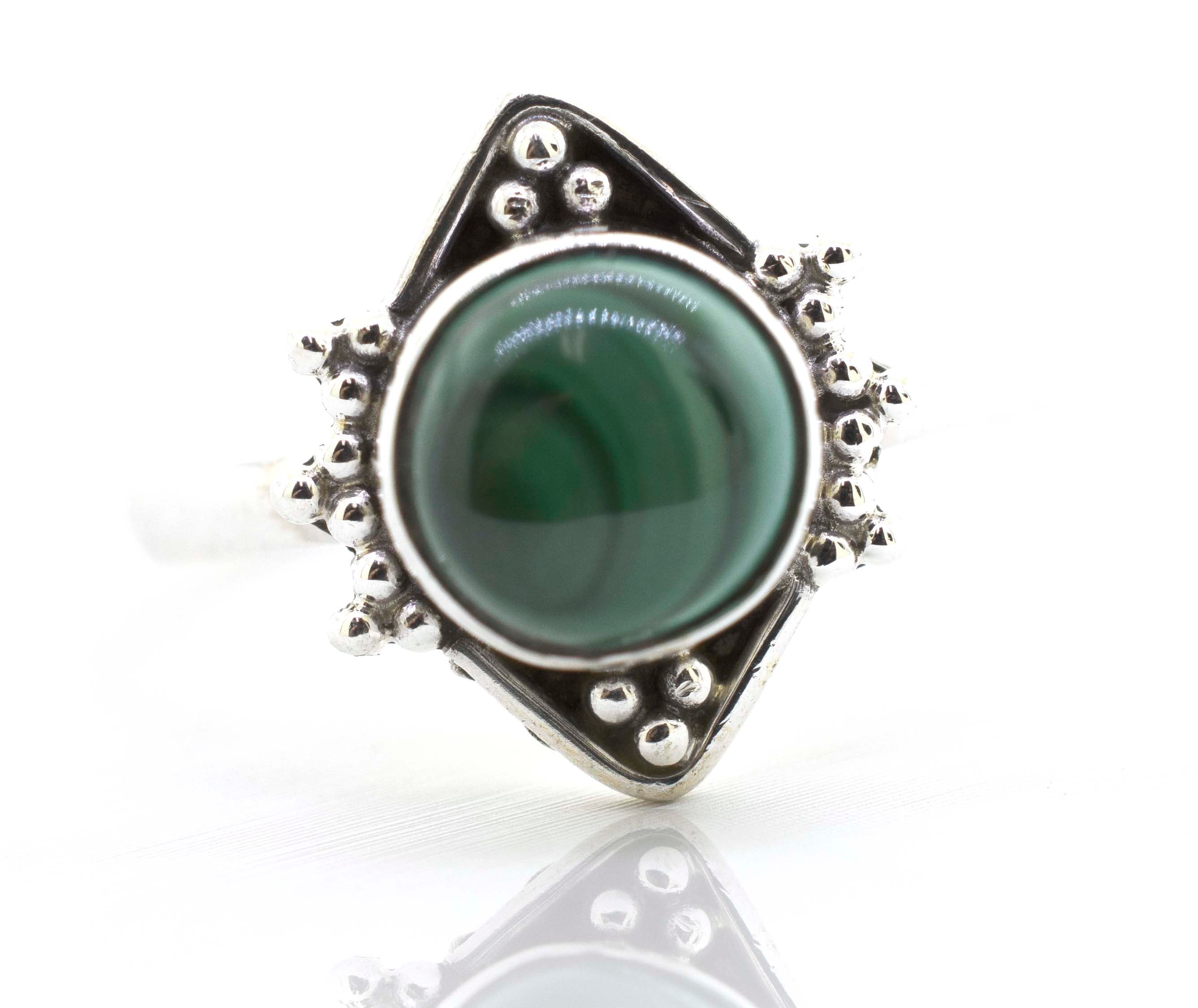 A Super Silver Round Gemstone Ring With Oxidized Diamond Shape Pattern with a green malachite gemstone.