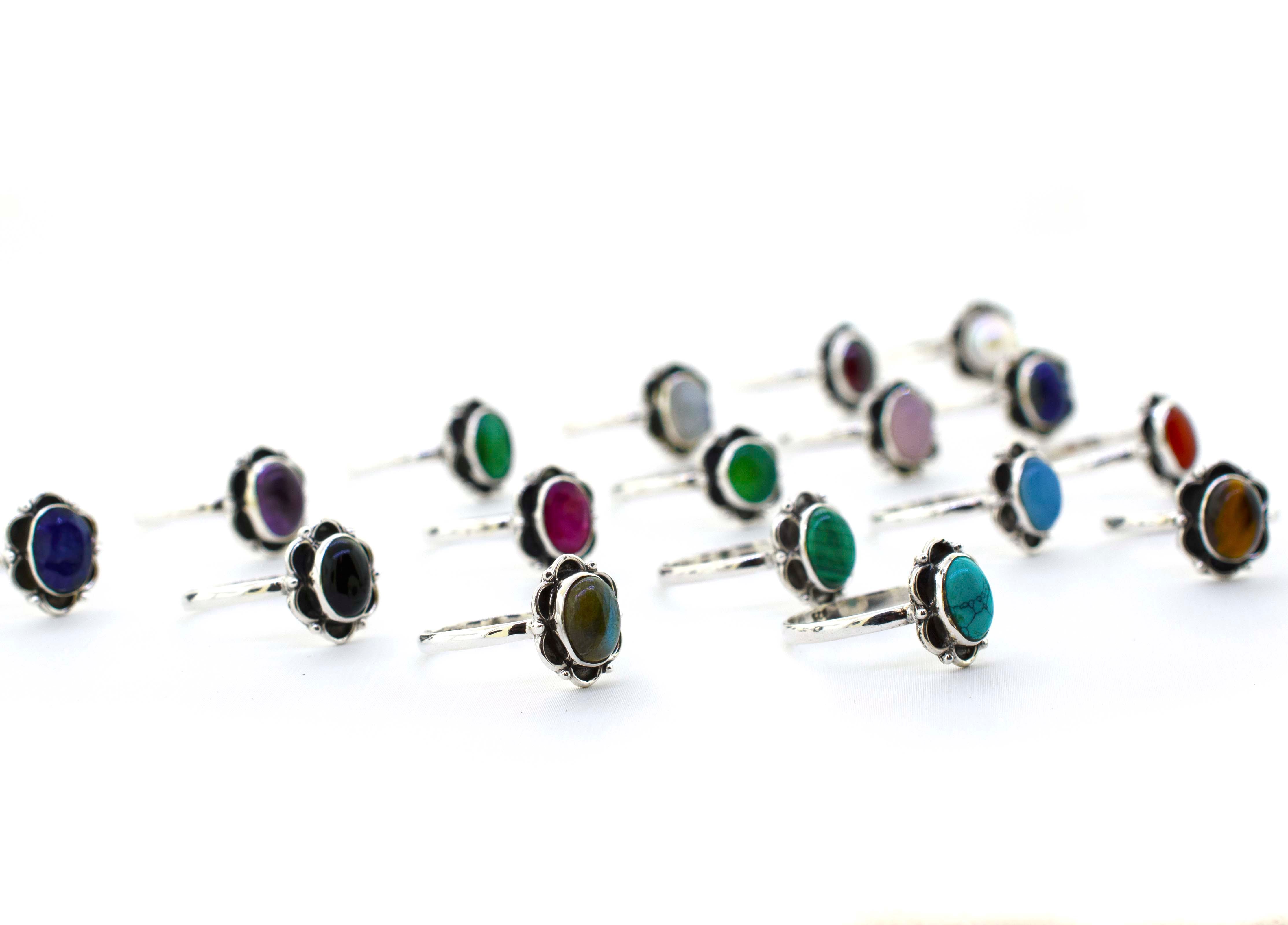 A Gemstone Ring With Oxidized Flower Design on a hippie white background.