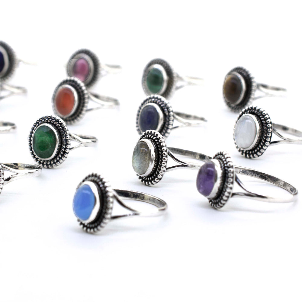 A group of Gemstone Oval Shield Rings with different colored stones, including cabochons.