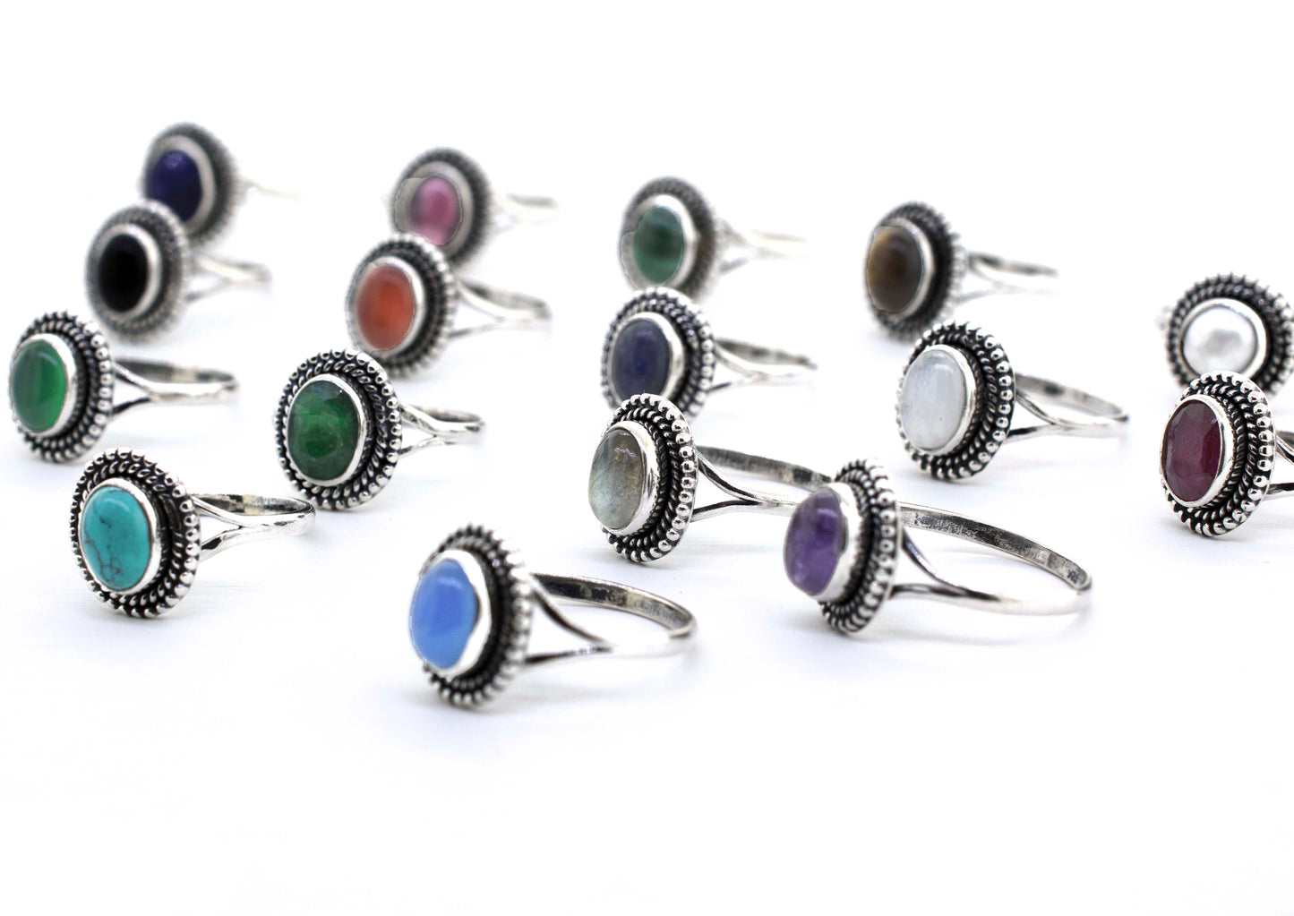 A group of Gemstone Oval Shield Rings with different colored stones, including cabochons.
