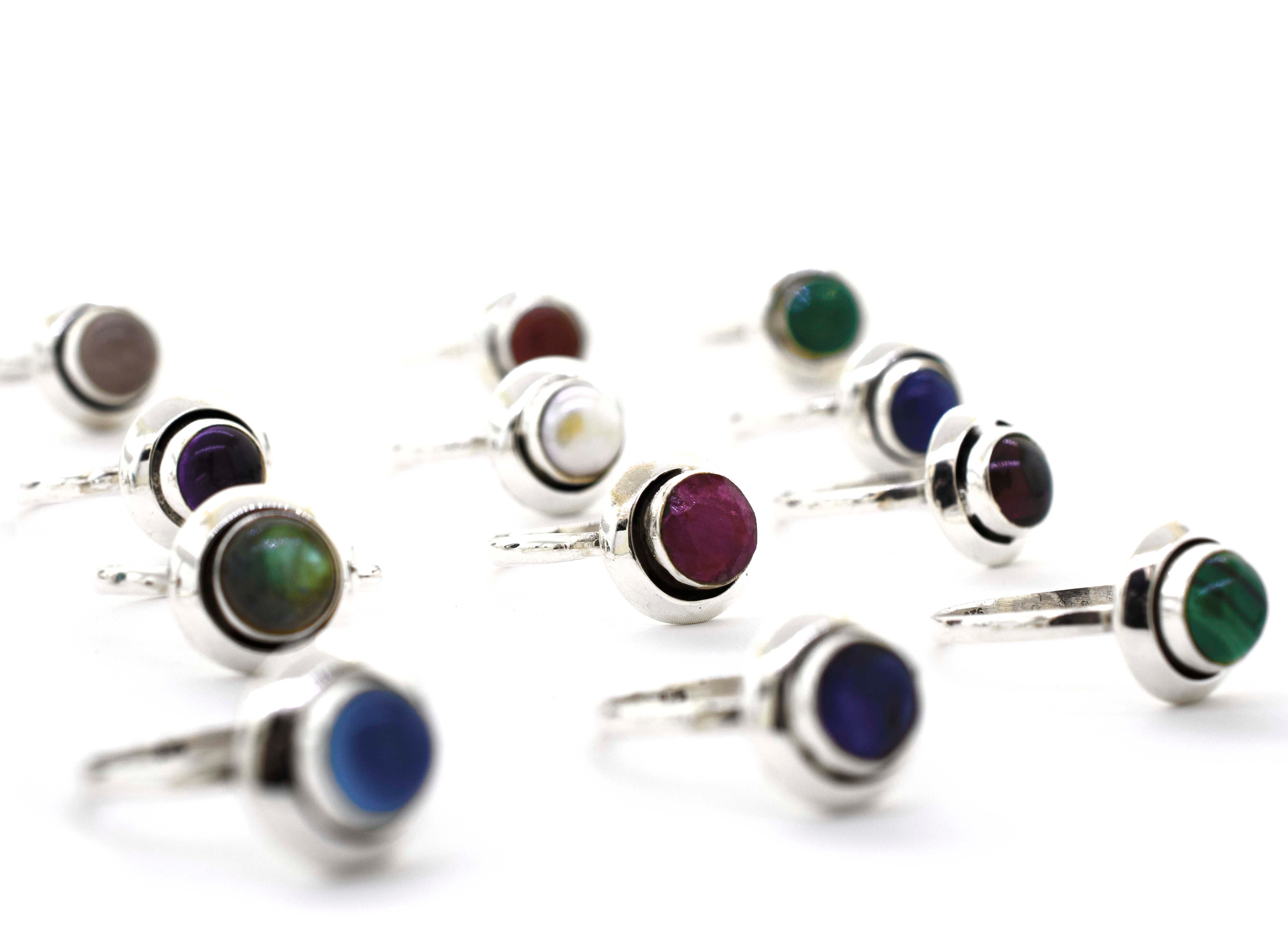 A group of Round Gemstone Rings With Oxidized Outline crafted from sterling silver.