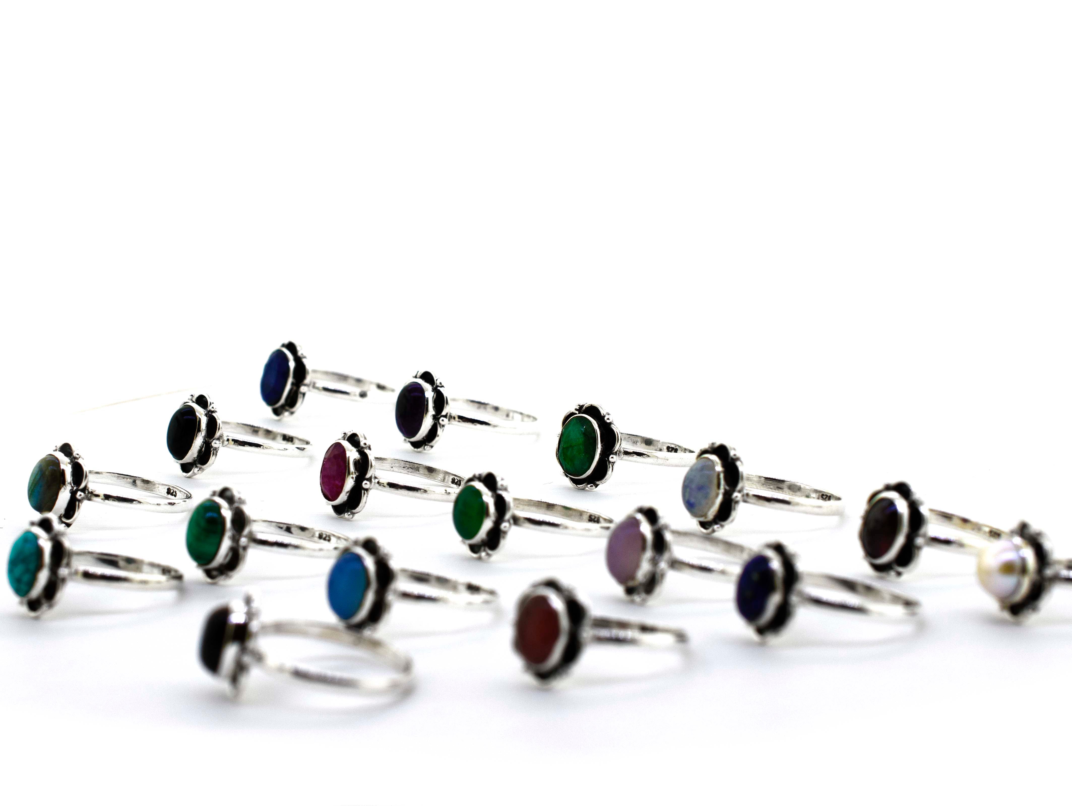 A boho-inspired collection of Gemstone Rings With Oxidized Flower Design.