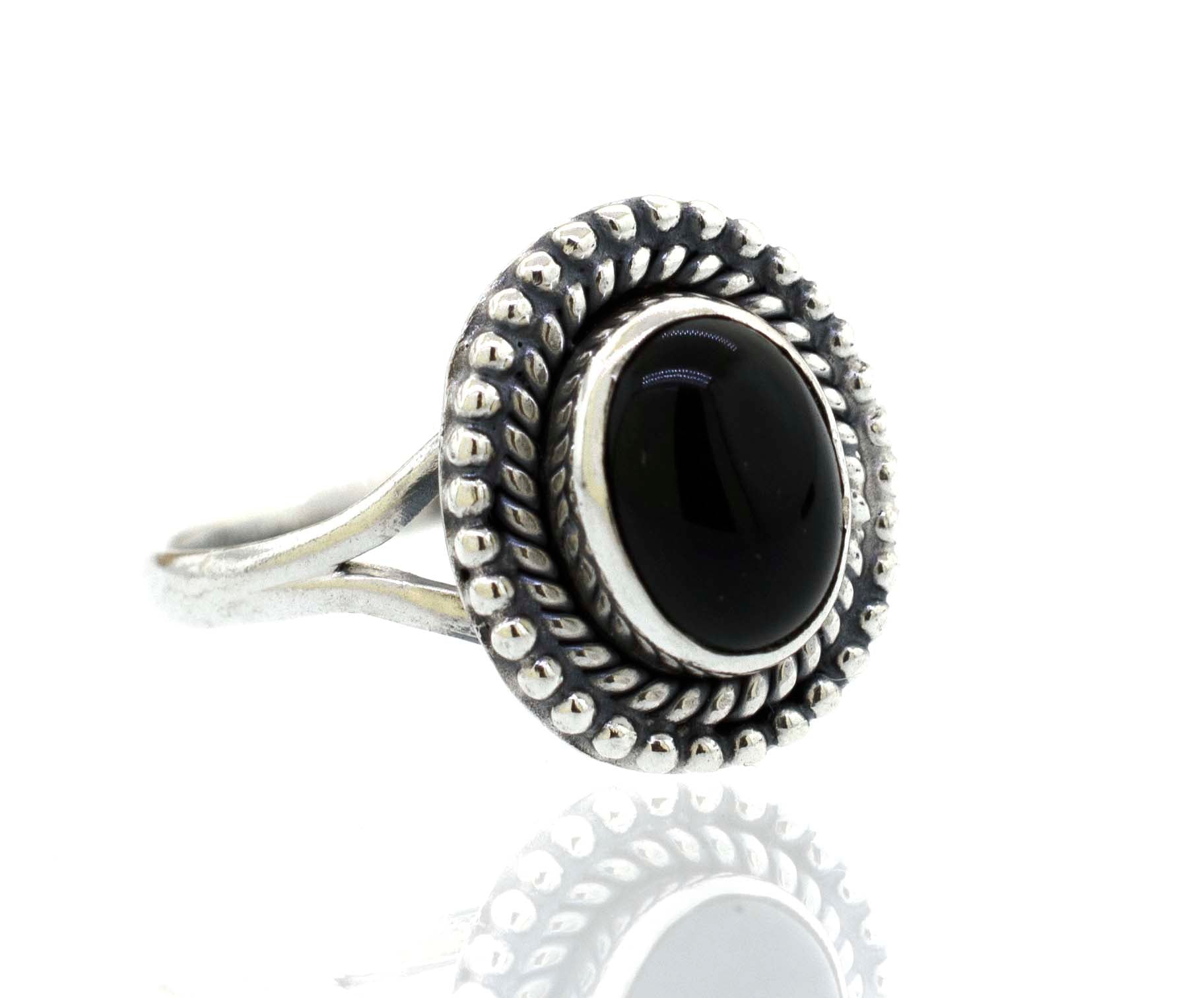 A Super Silver Gemstone Oval Shield Ring with an oval black onyx stone.
