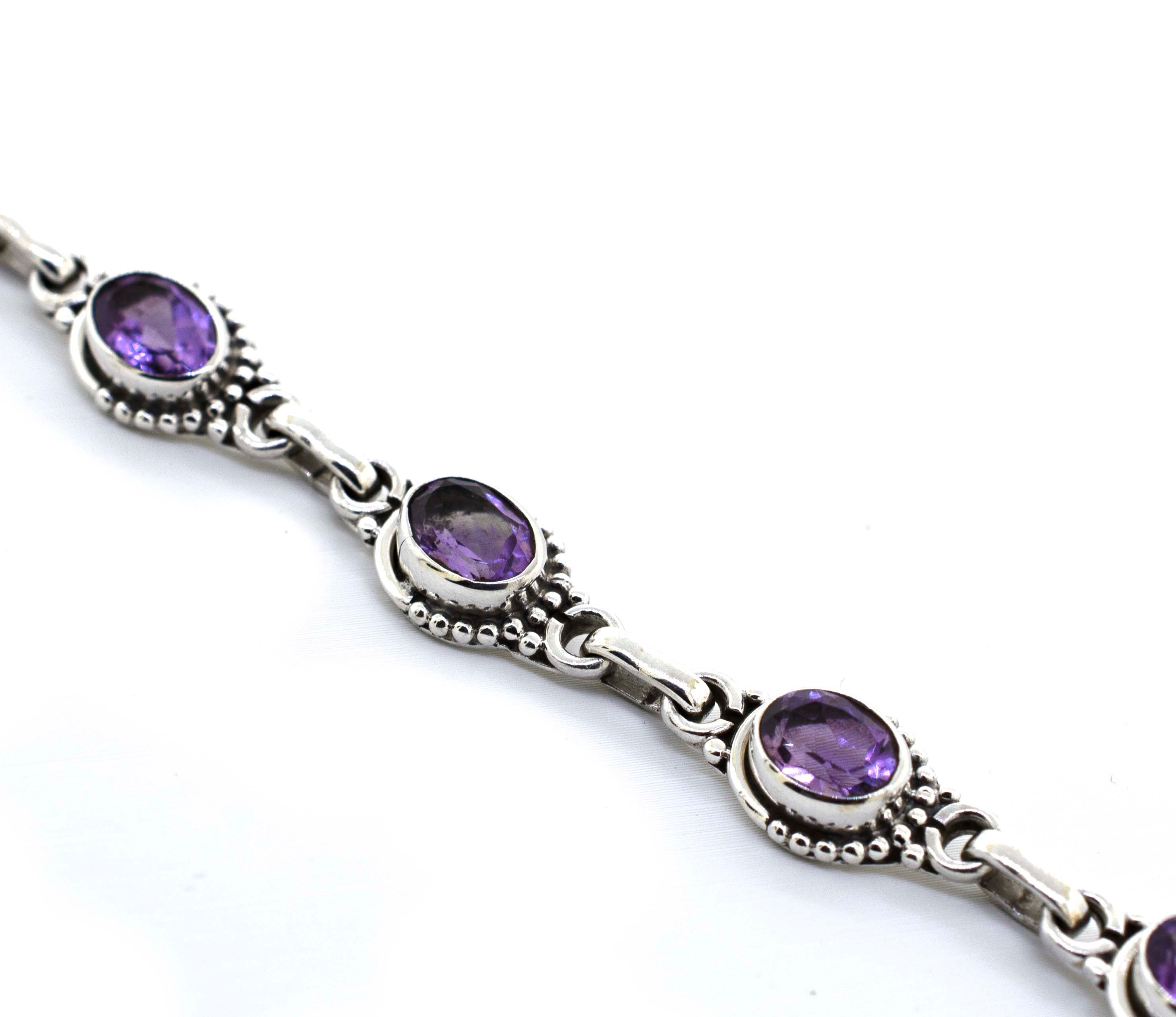 Super Silver's Oval Gemstone Bracelet with Half Ball Border, showcasing a stunning amethyst gemstone.