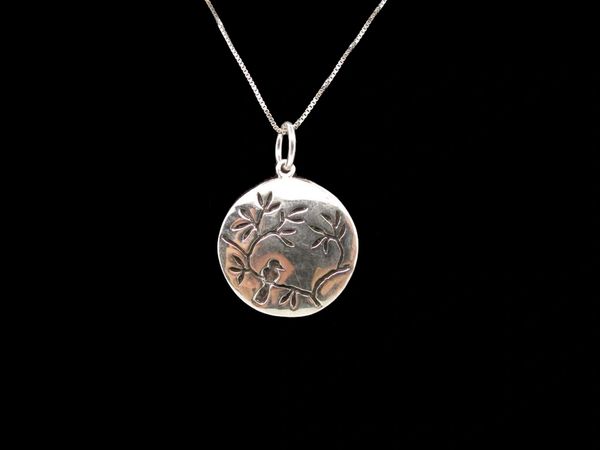 A Super Silver Small Circle Nature Charm With Bird.