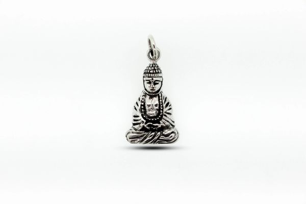 A Super Silver Meditating Gautama Buddha Charm for meditation on a white background.