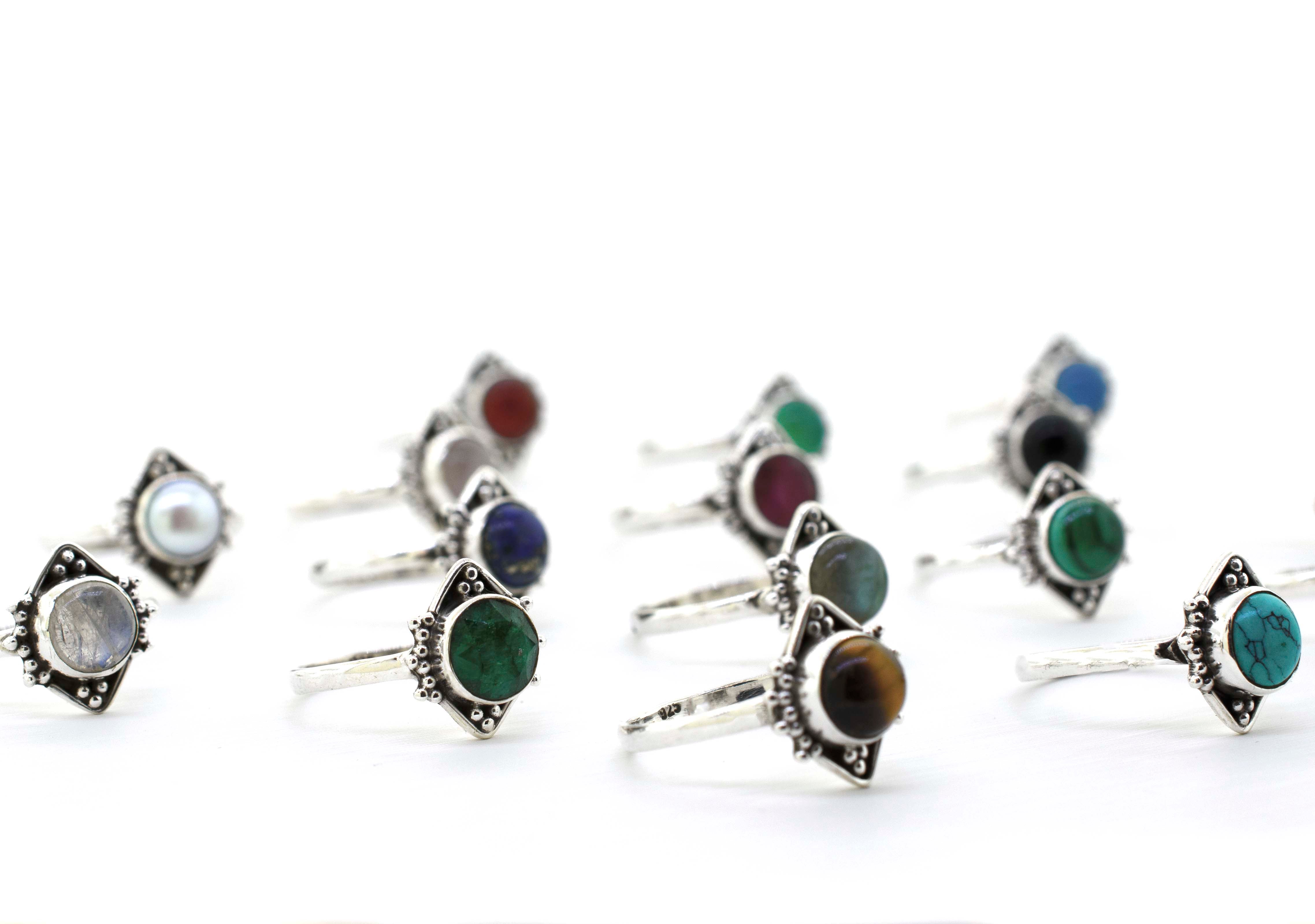 A boho-inspired collection of Round Gemstone Rings With Oxidized Diamond Shape Pattern featuring an array of colorful stones.