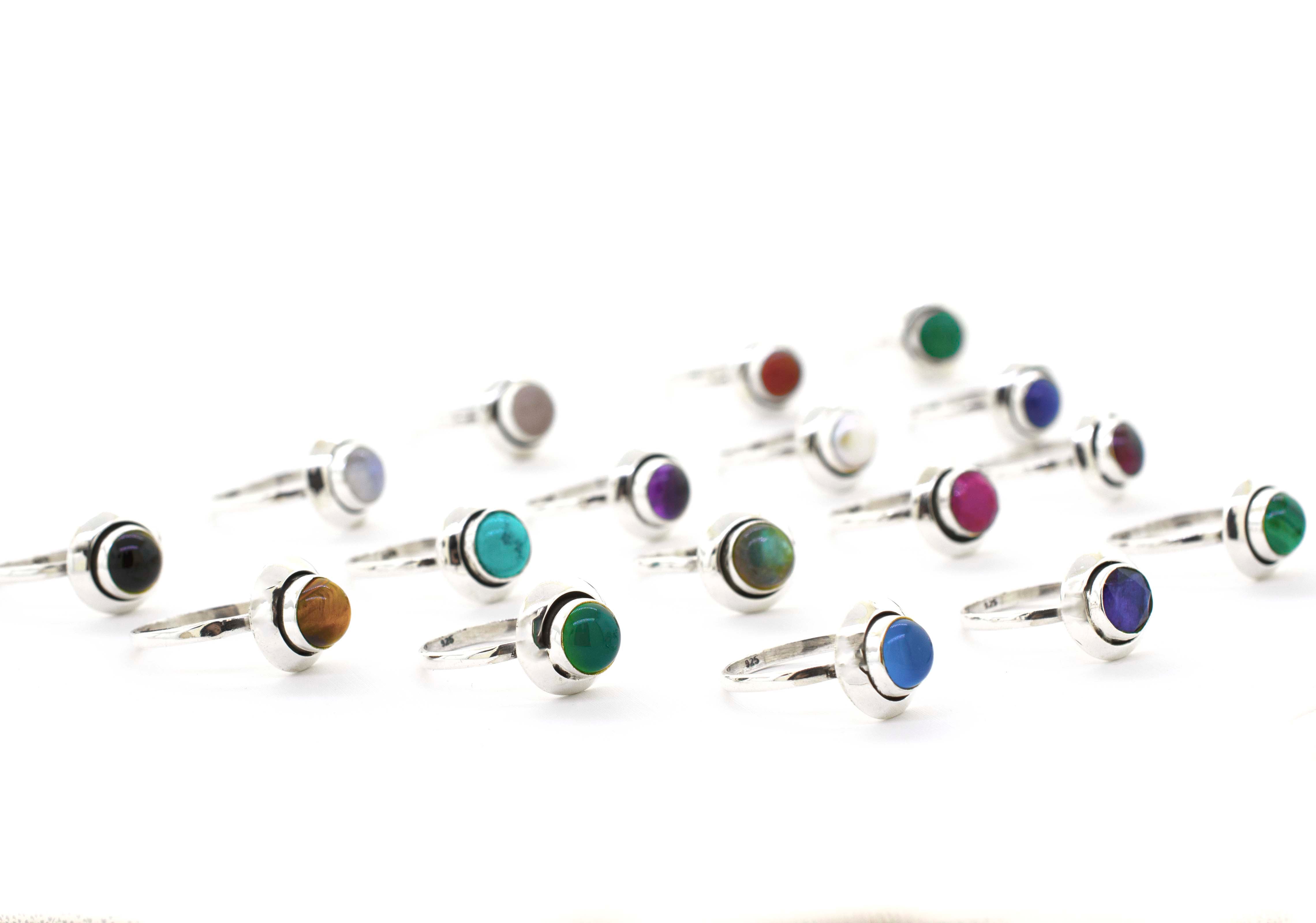 A group of Round Gemstone Rings With Oxidized Outline on a white background, perfect for the Santa Cruz hippie vibe.