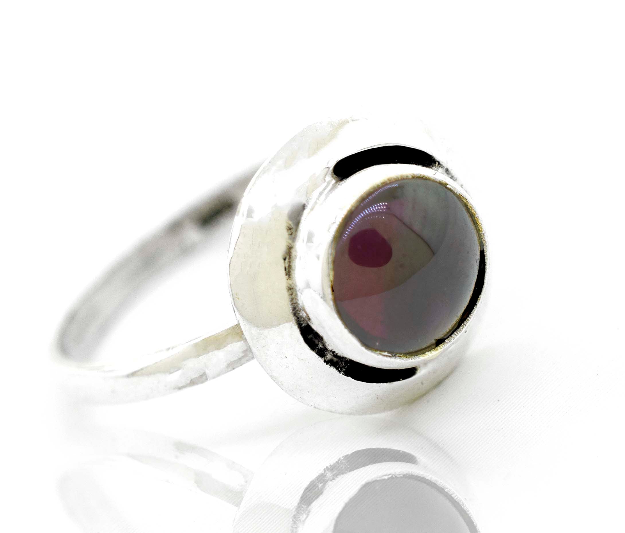 A contemporary Round Gemstone Ring With Oxidized Outline from Super Silver, featuring a silver band and a vibrant red stone.