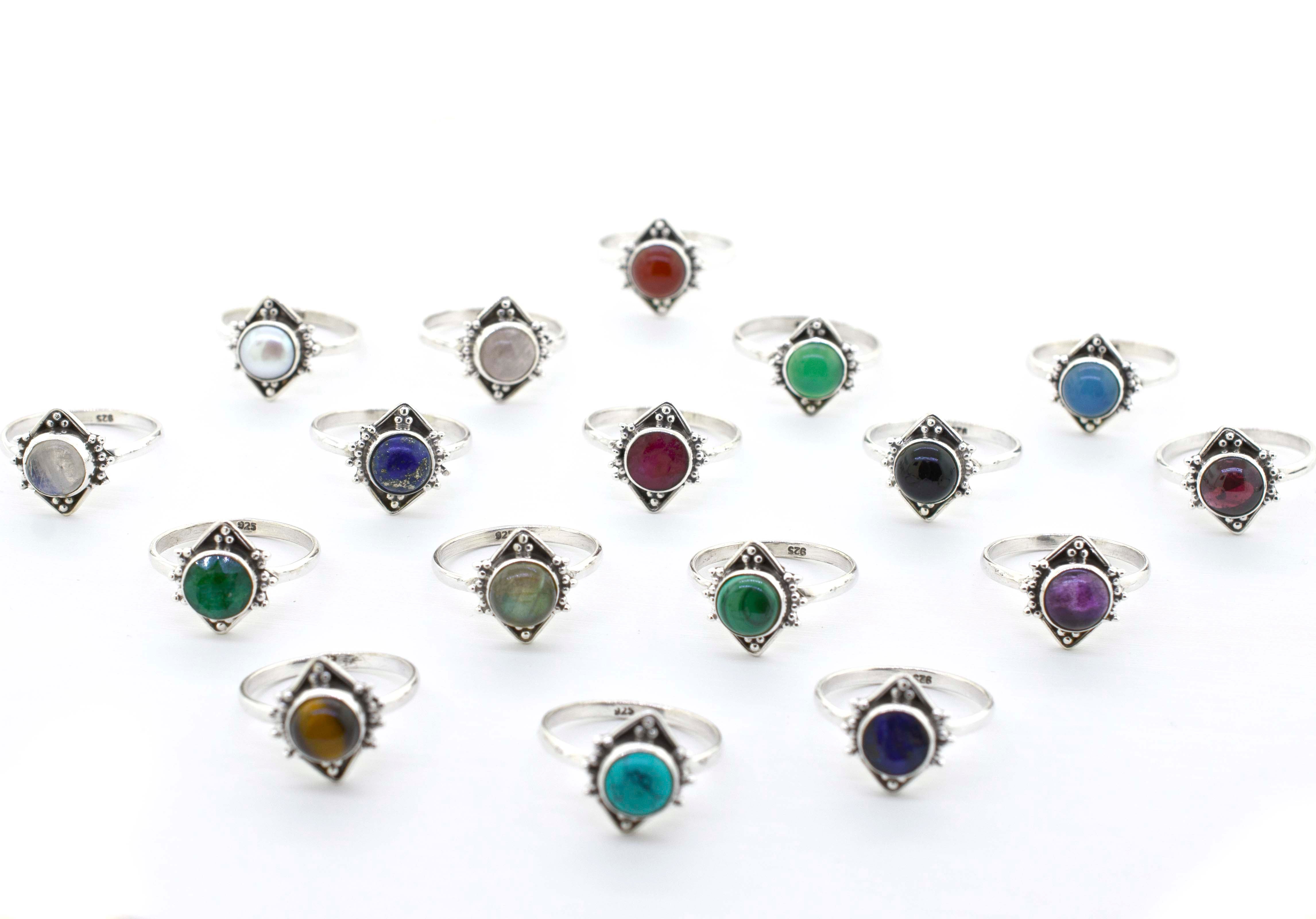 A group of Round Gemstone Rings With Oxidized Diamond Shape Patterns that exude a hippie vibe.