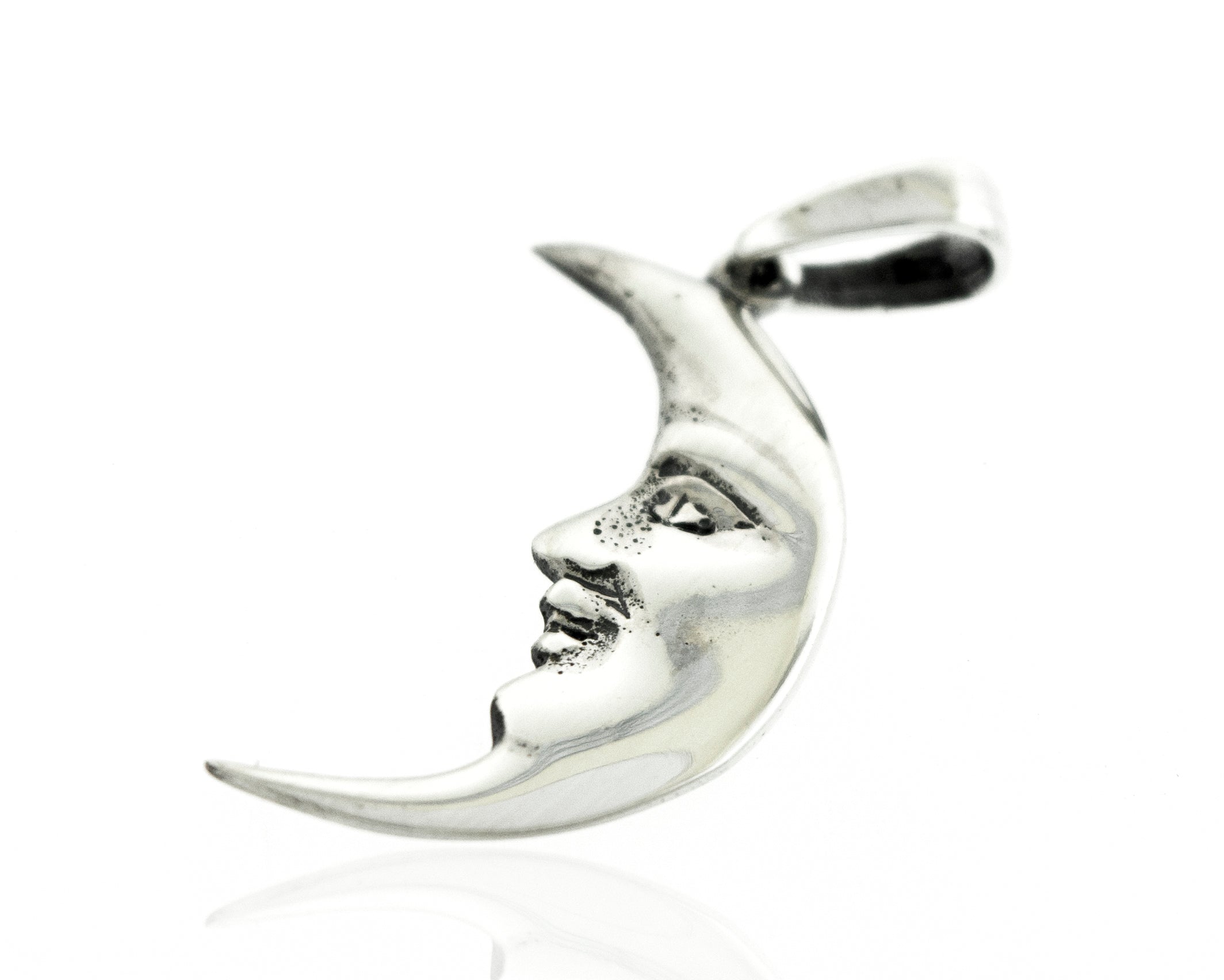 A Super Silver Crescent Man In The Moon Pendant with a face on it.