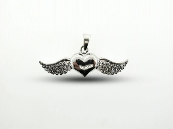 A Super Silver Heart With Wings Pendant with an oxidized finish on a white background.