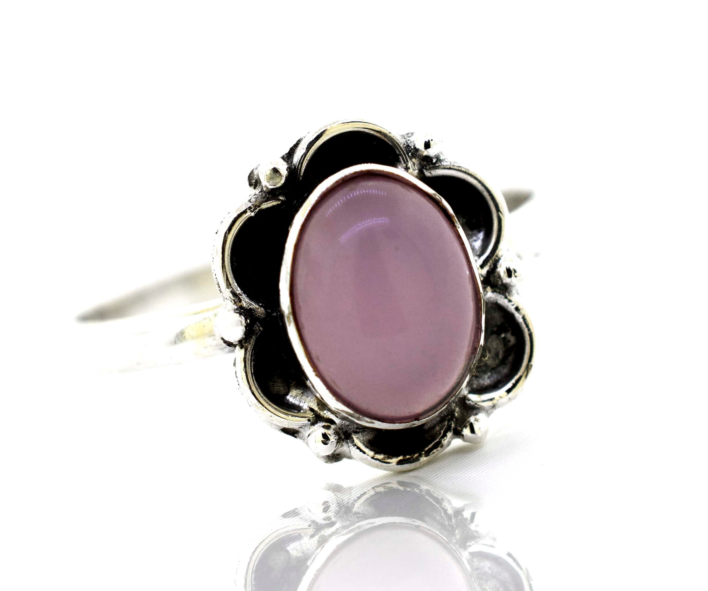 A hippie-inspired Gemstone Ring With Oxidized Flower Design.