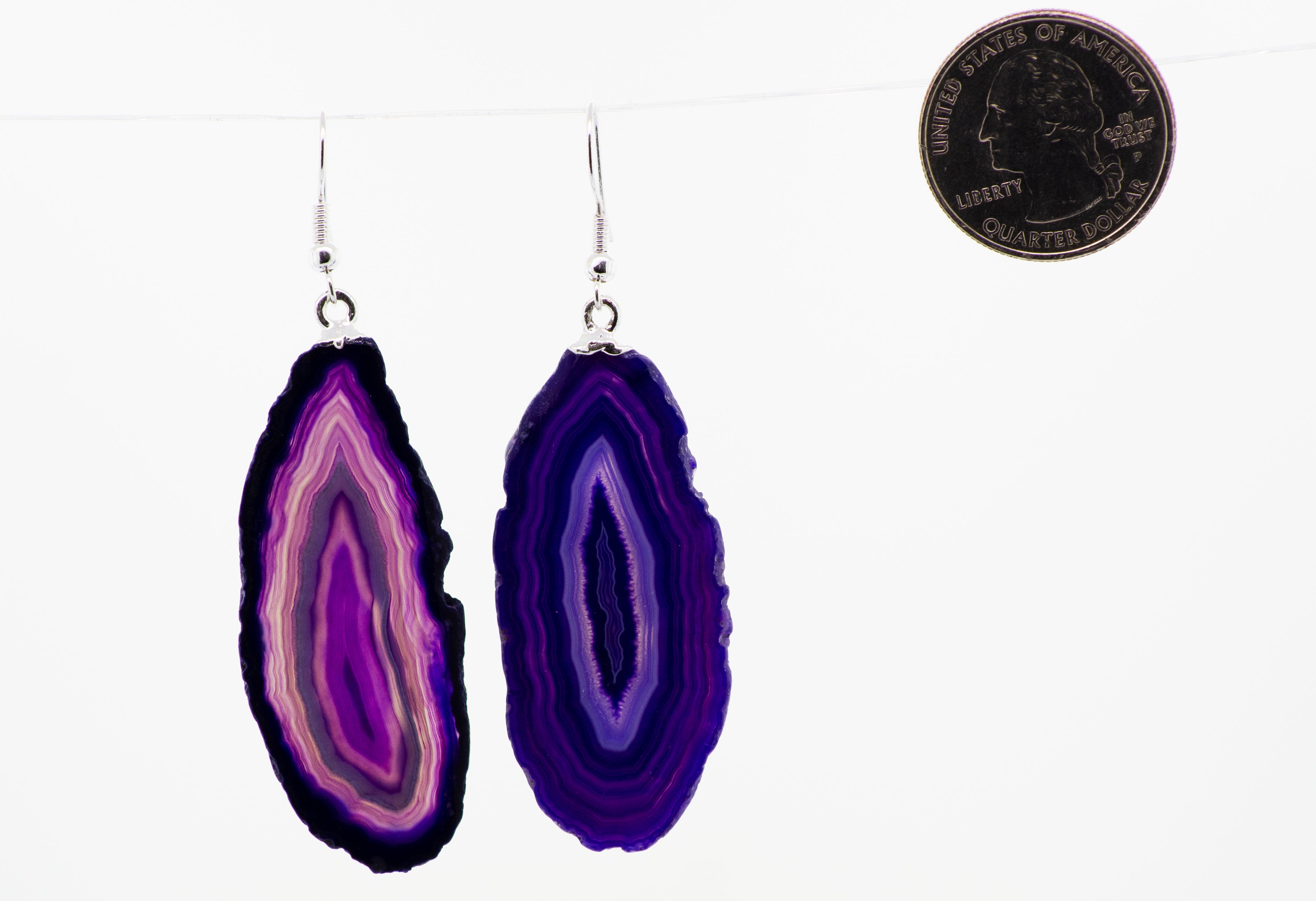 A purple Agate Slice Earrings hanging from a string, adorned with Super Silver plated french hooks.