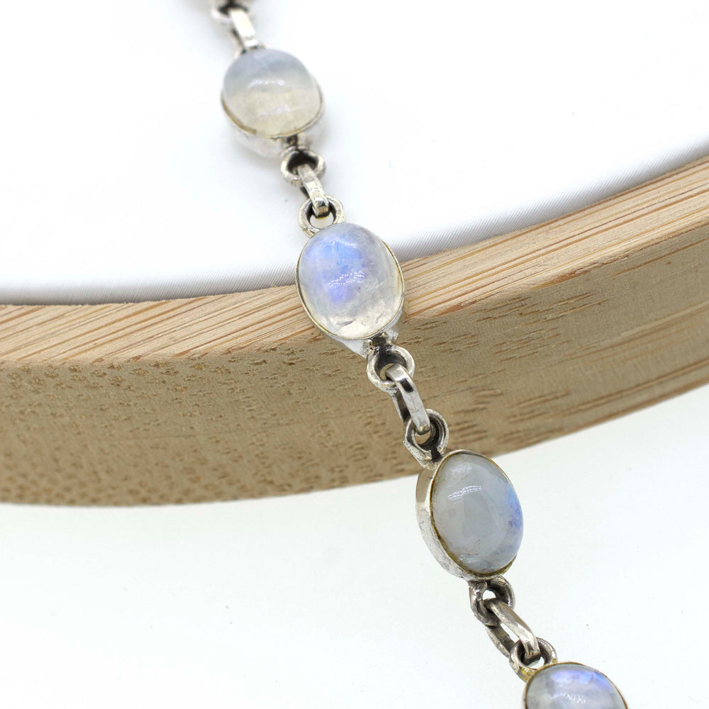
                  
                    A Super Silver Simple Oval Gemstone Bracelet adorned with moonstones, a timeless gemstone.
                  
                