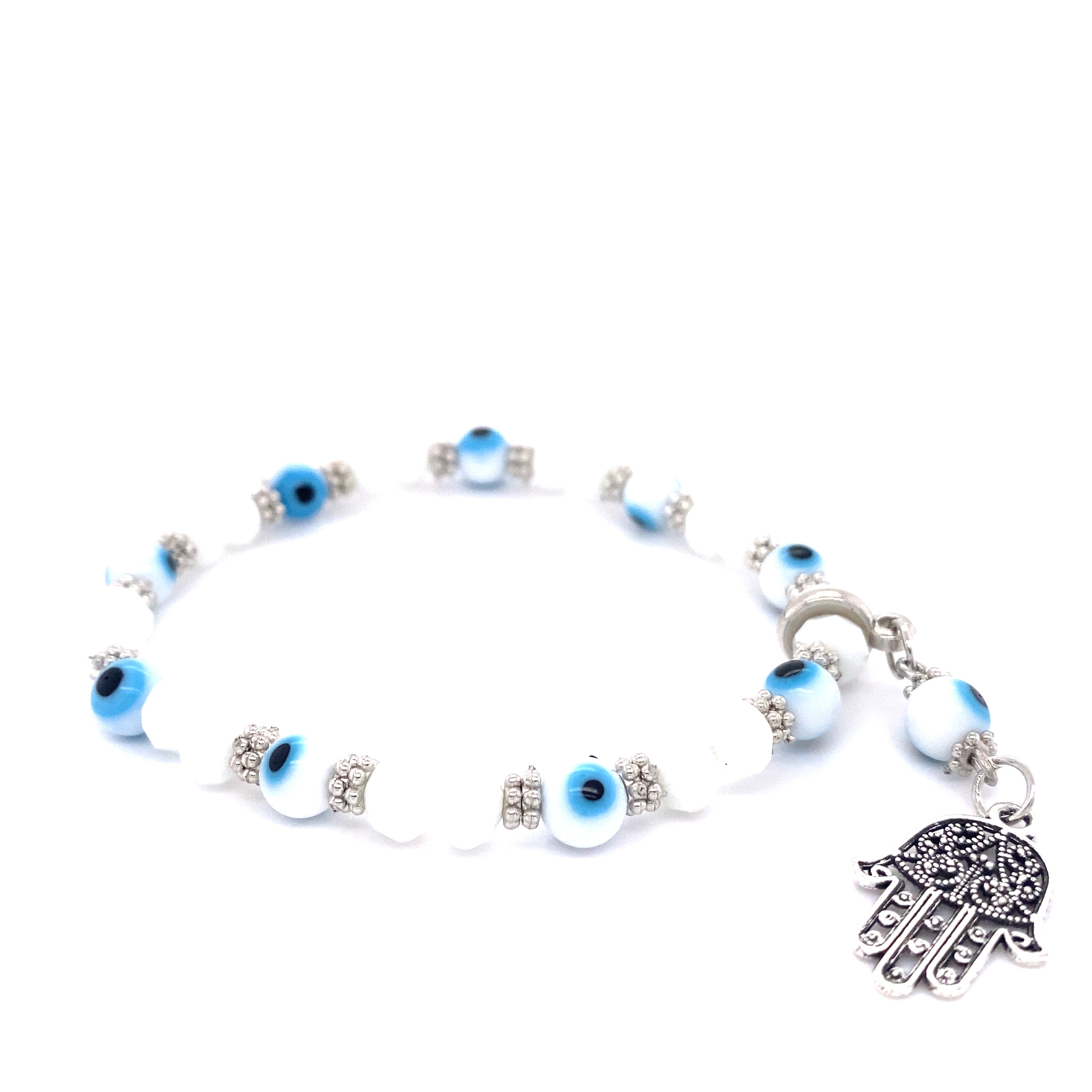 A Super Silver stacking bracelet featuring an Evil Eye Stretch bracelet with Hamsa Charm.