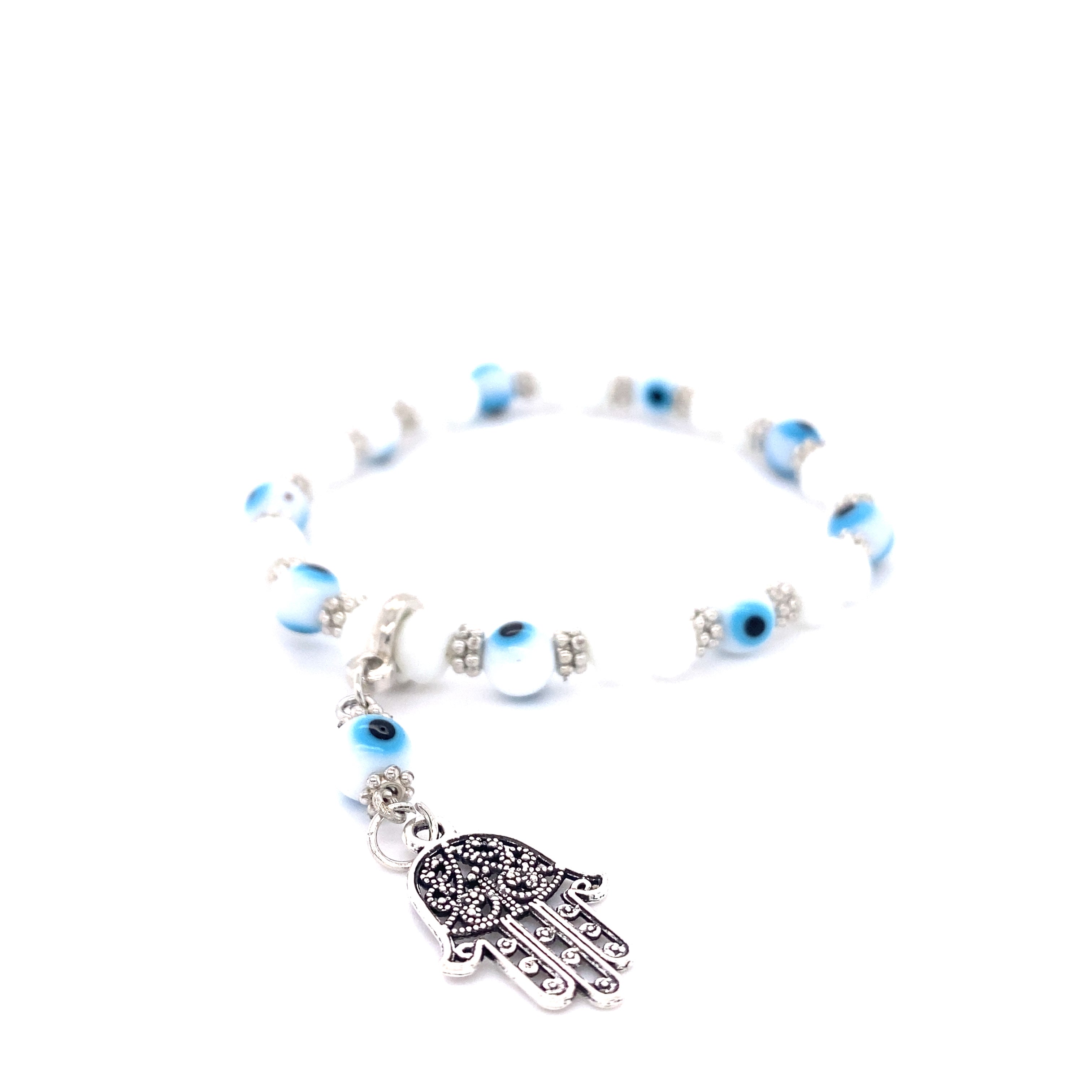 A Super Silver stacking bracelet adorned with an Evil Eye Stretch bracelet with Hamsa Charm.