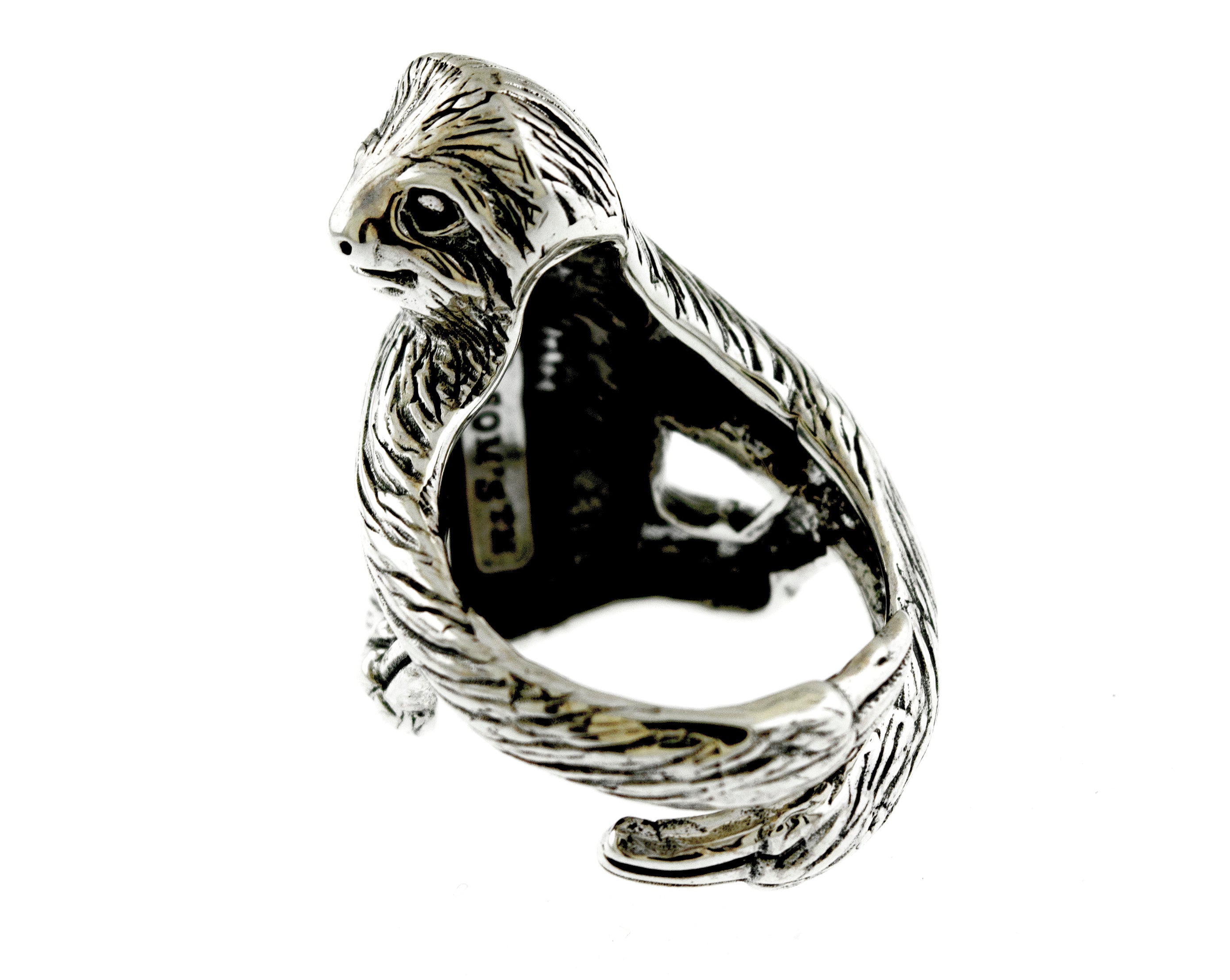 A Detailed Sloth Ring with a bird on it, designed by an artisan.