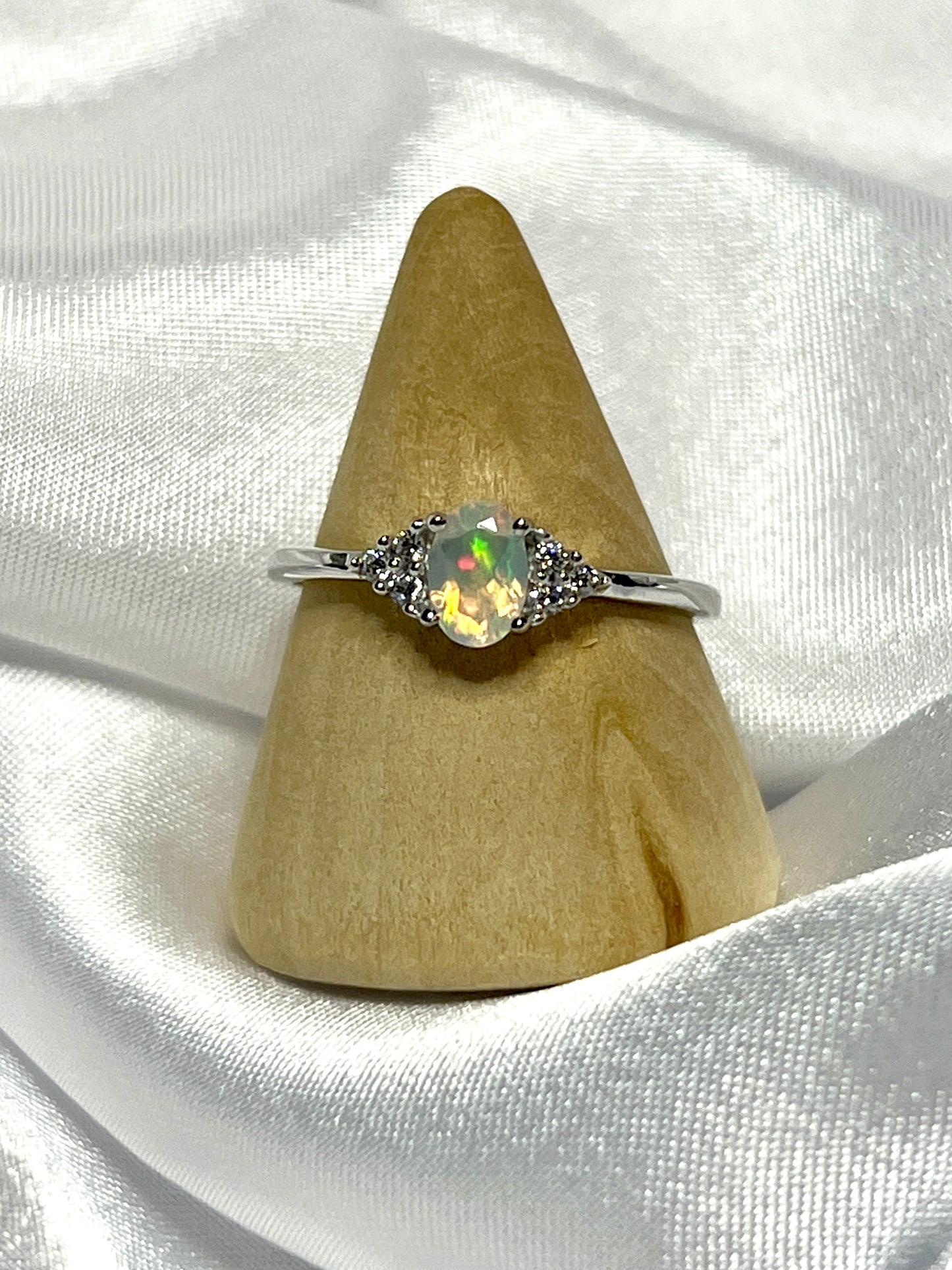 An Ethiopian Opal Ring with Cubic Zirconia Stones and diamond statement ring.