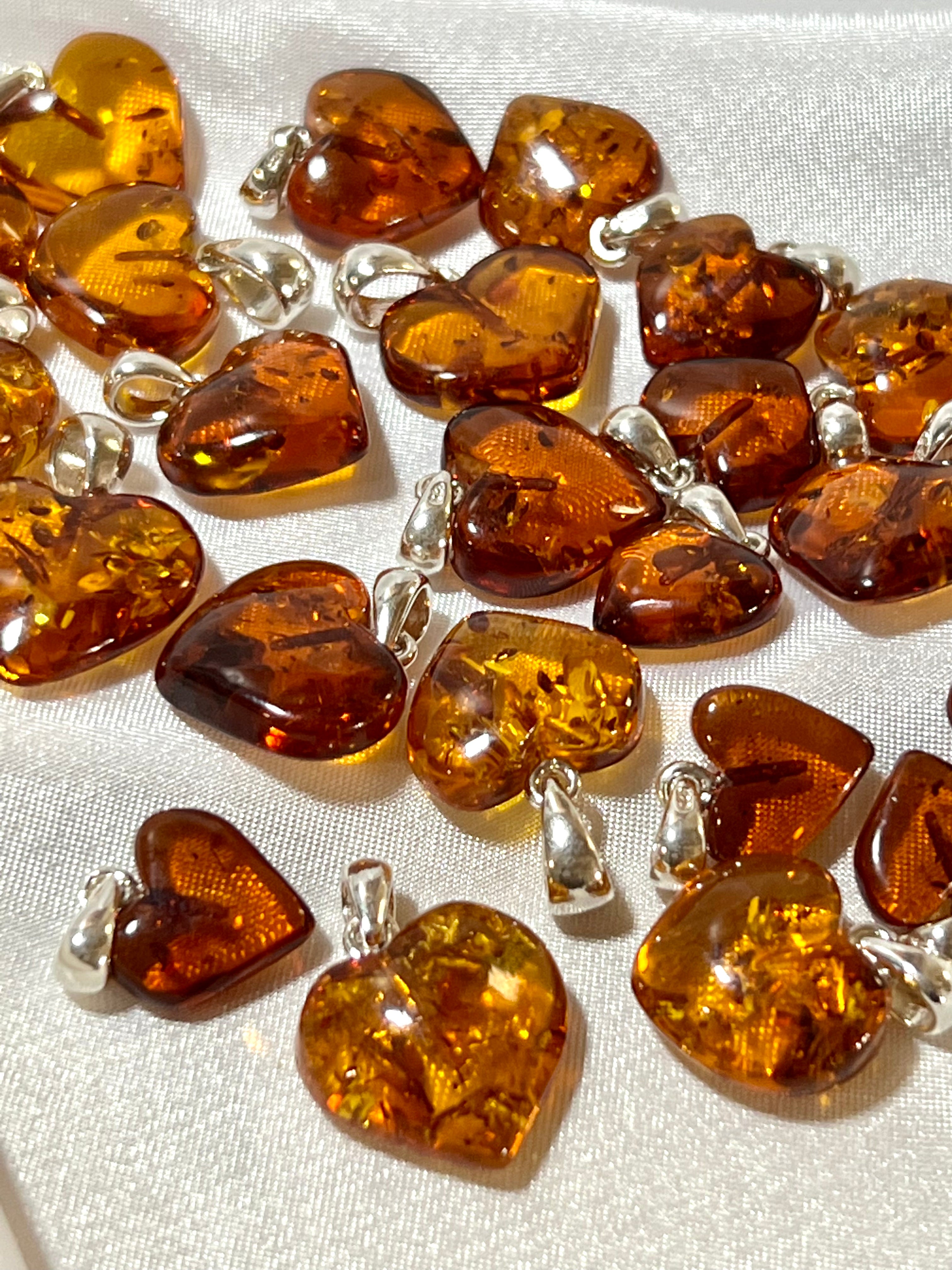 Super Silver's Charming Baltic Amber Heart Pendant charms.