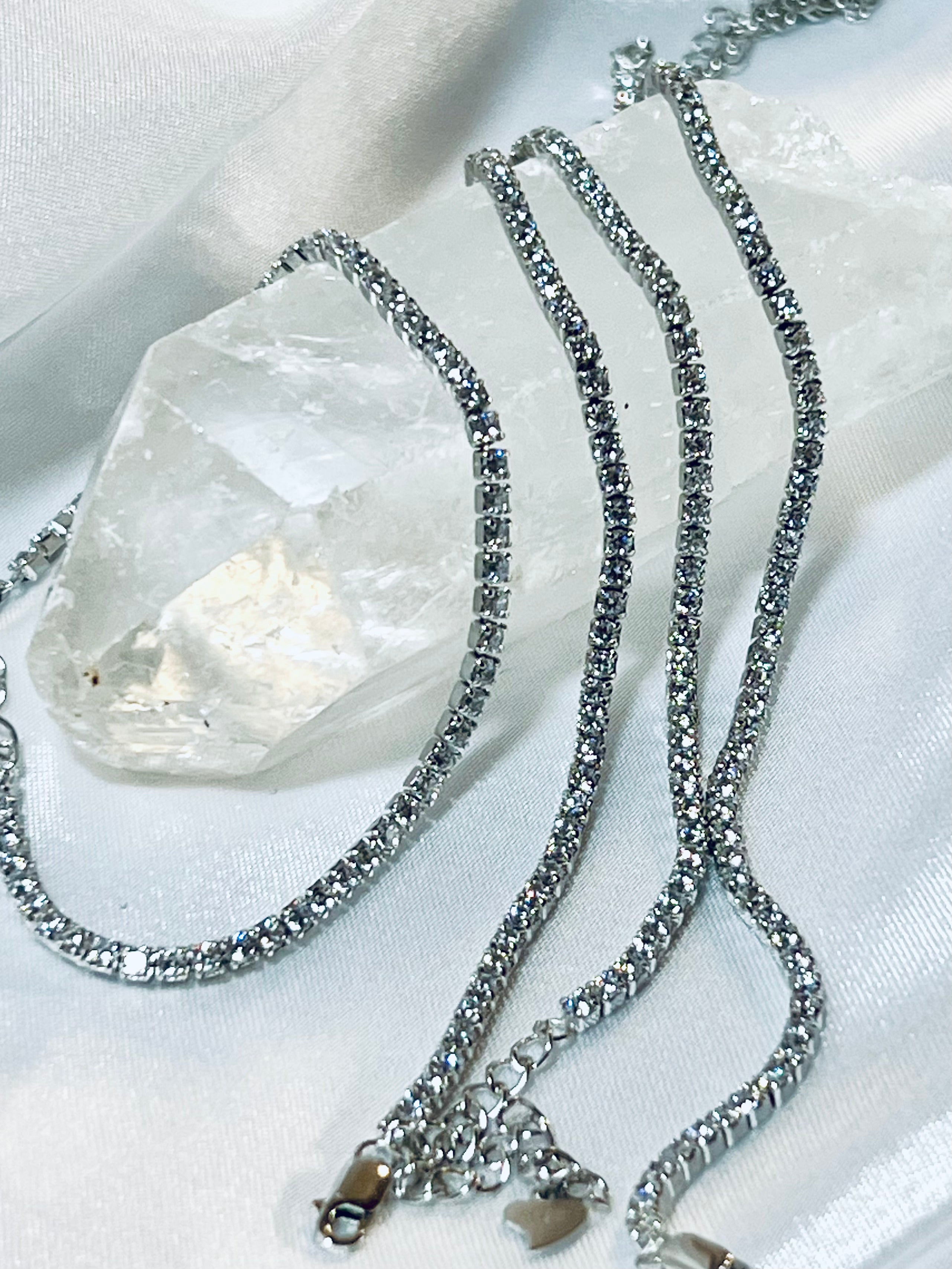 A pair of Super Silver Square Cubic Zirconia Tennis Bracelets adorned with sparkling cubic zirconia crystals.