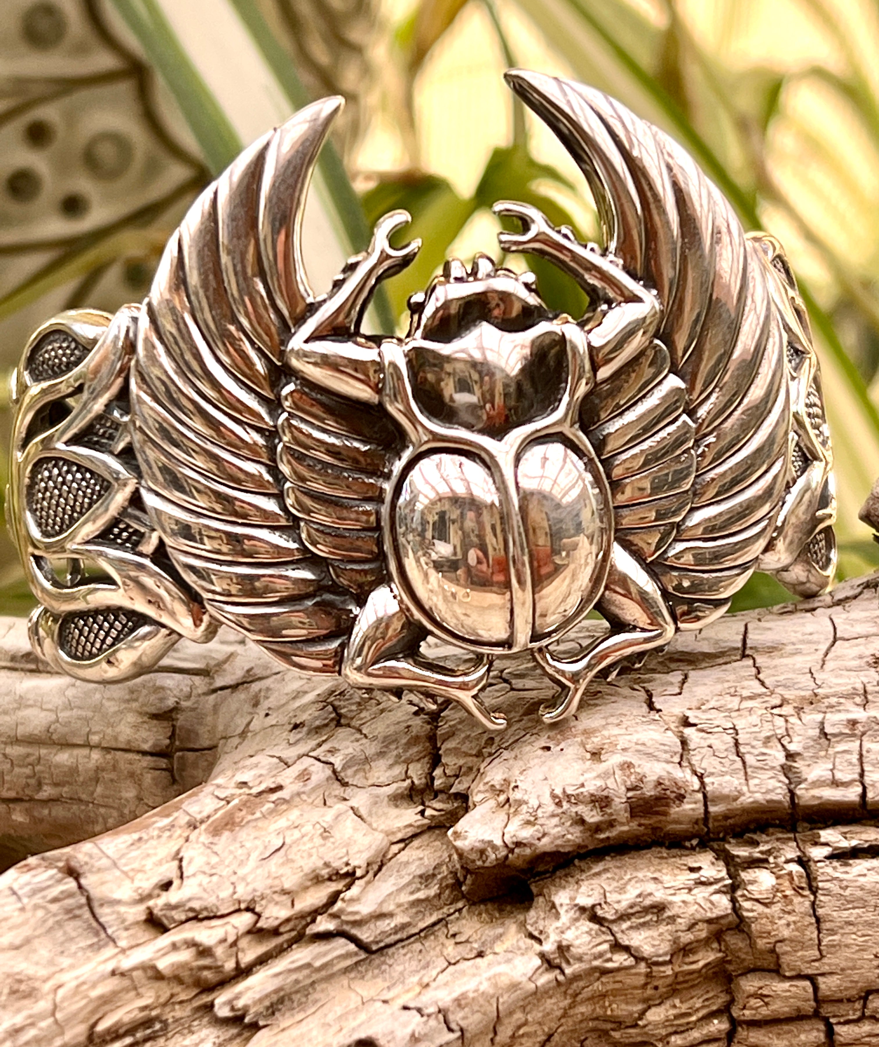 Super Silver Scarab with Wings cuff bracelet featuring a winged scarab and lotus flowers.