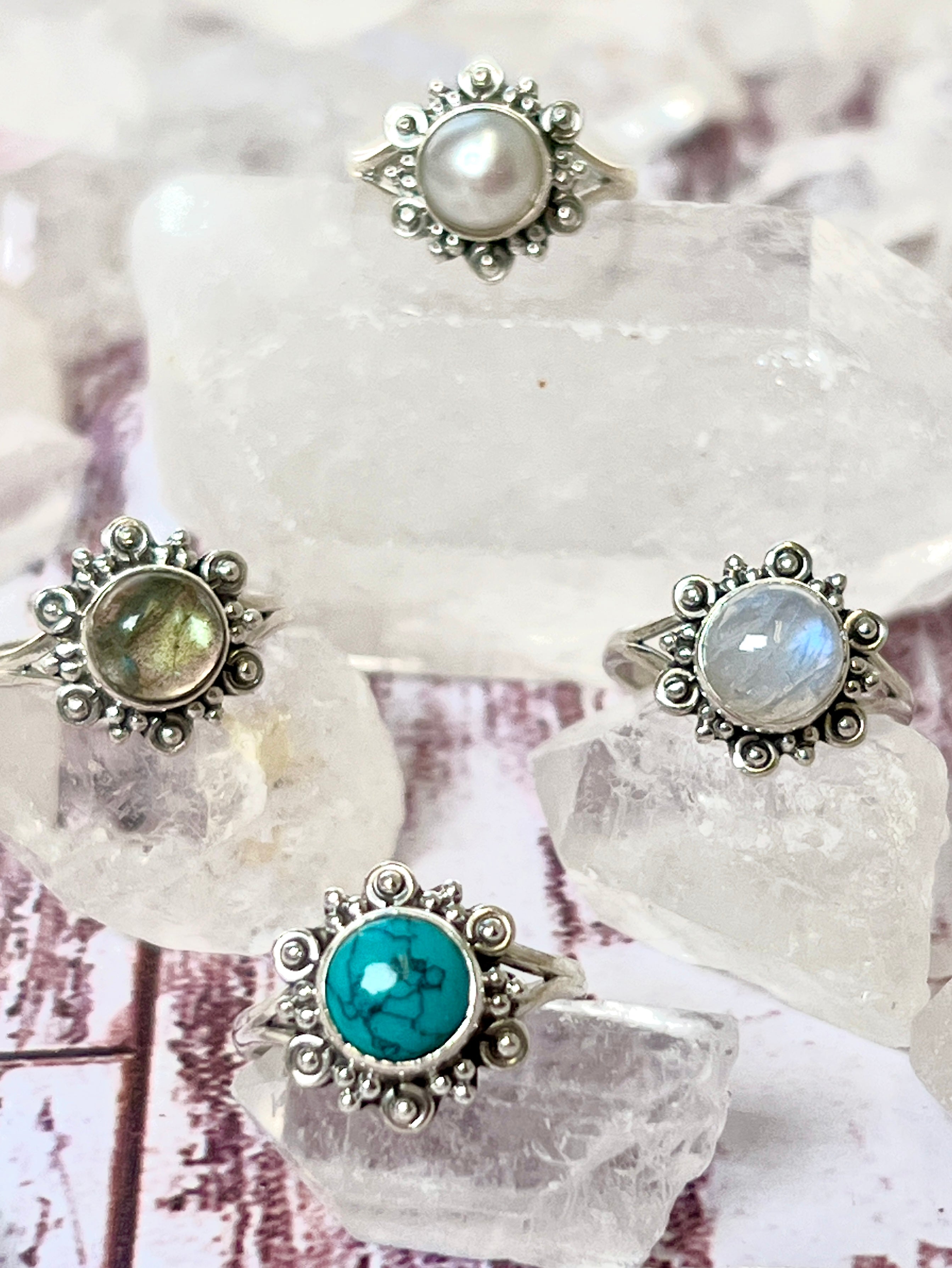 Four beautiful round flower rings with natural gemstones, perfect for the boho or hippie style.