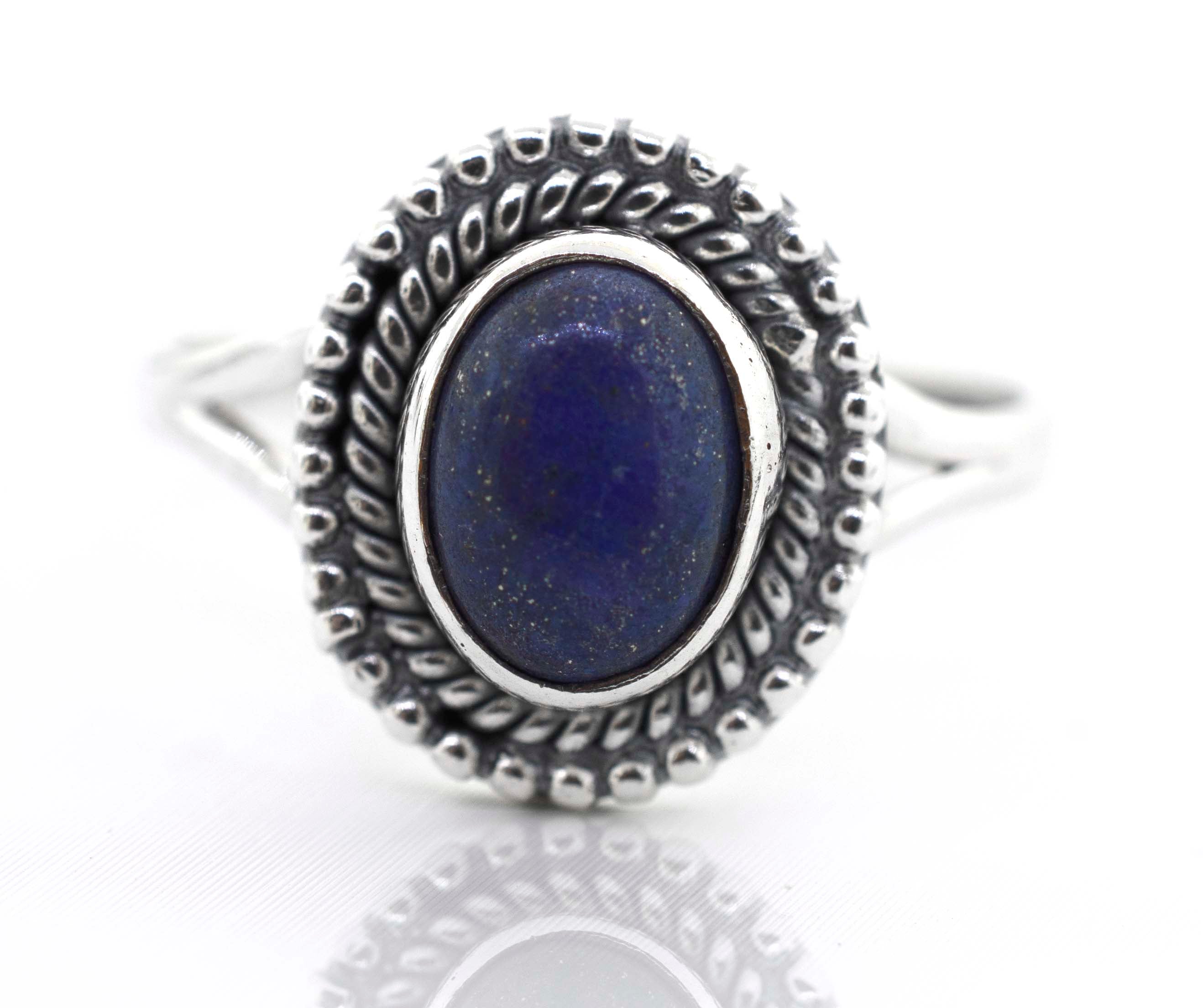 An Gemstone Oval Shield Ring on a white background.