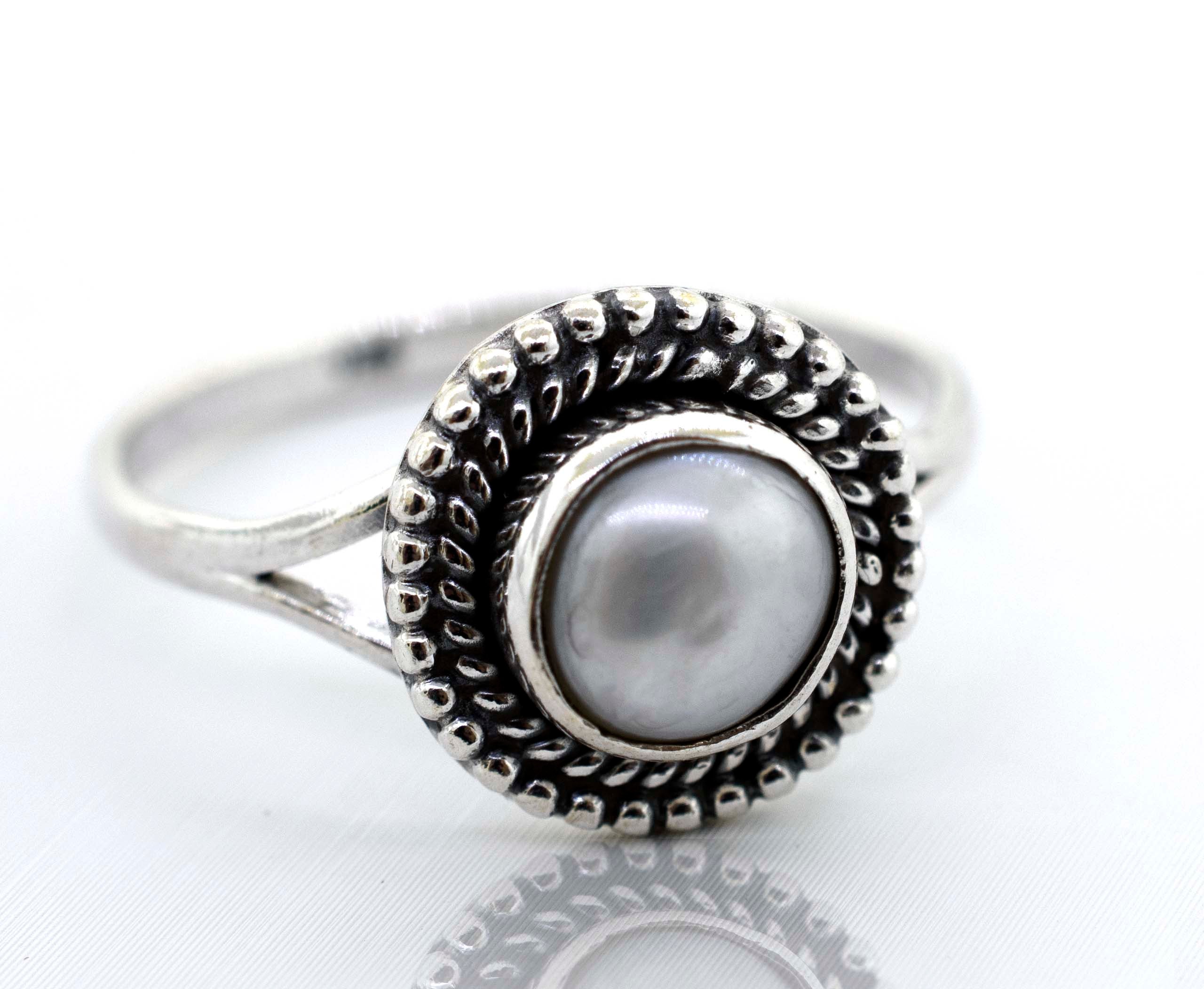 A Vintage Super Silver Gemstone Oval Shield Ring with a pearl gemstone at the center.