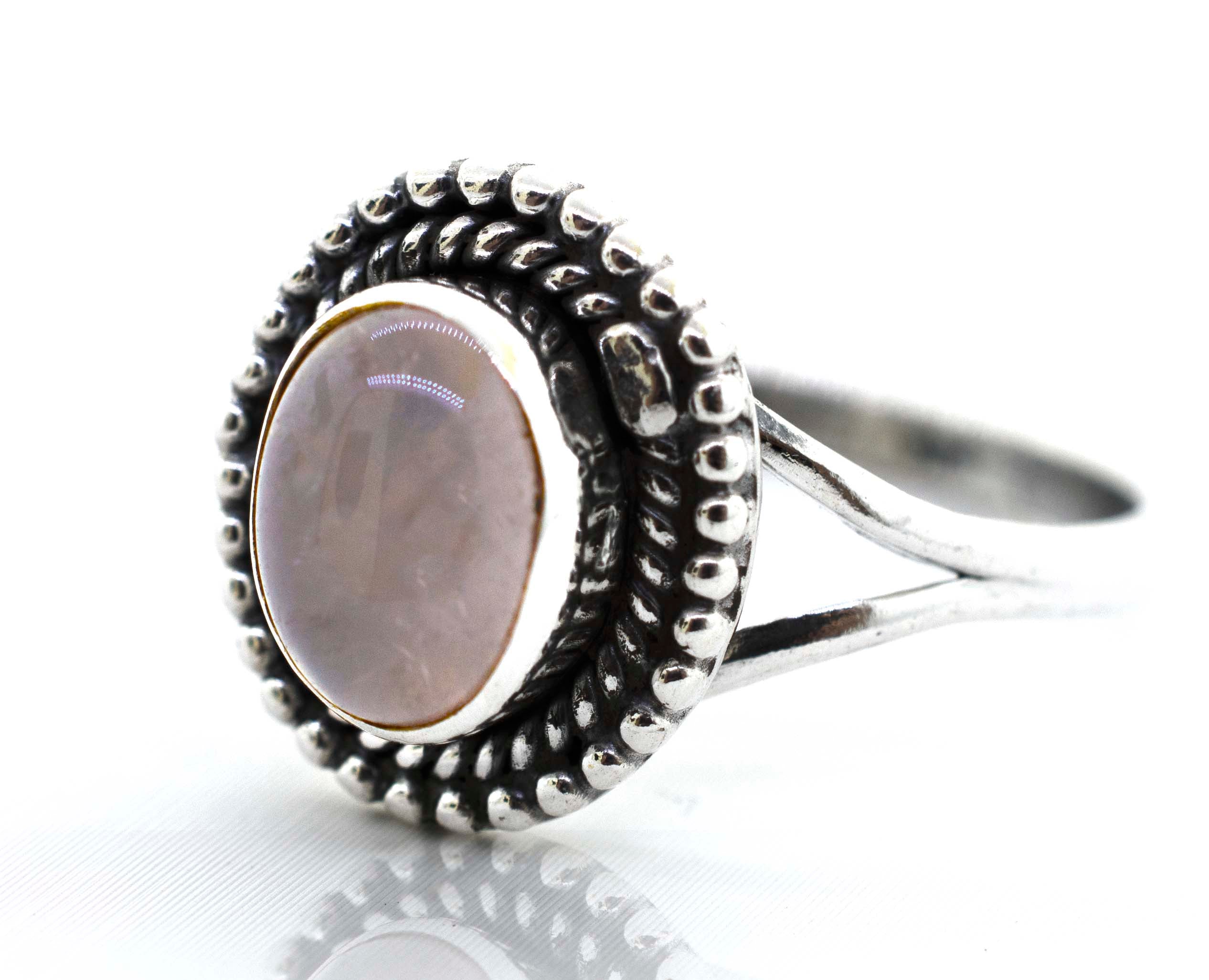 A Super Silver Gemstone Oval Shield Ring with an oval-shaped pink gemstone in the center.