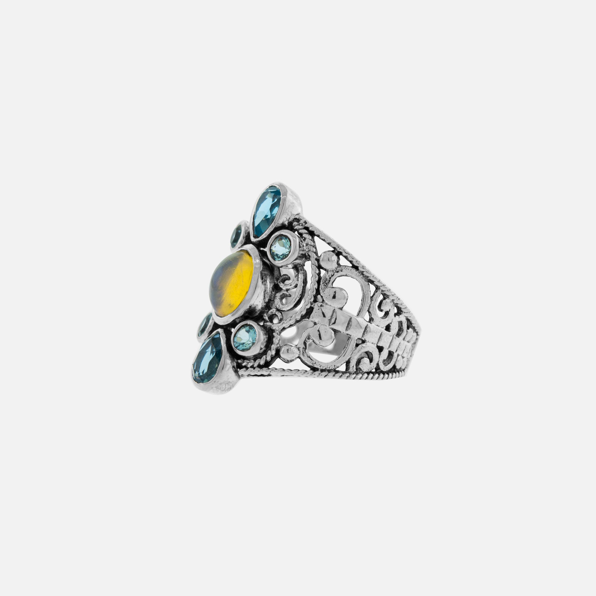 An elegant silver engagement ring with a yellow stone and blue topaz. (Replace "engagement ring with a yellow stone and blue topaz" with "Elegant Ring with Blue Topaz and Ethiopian Opal")