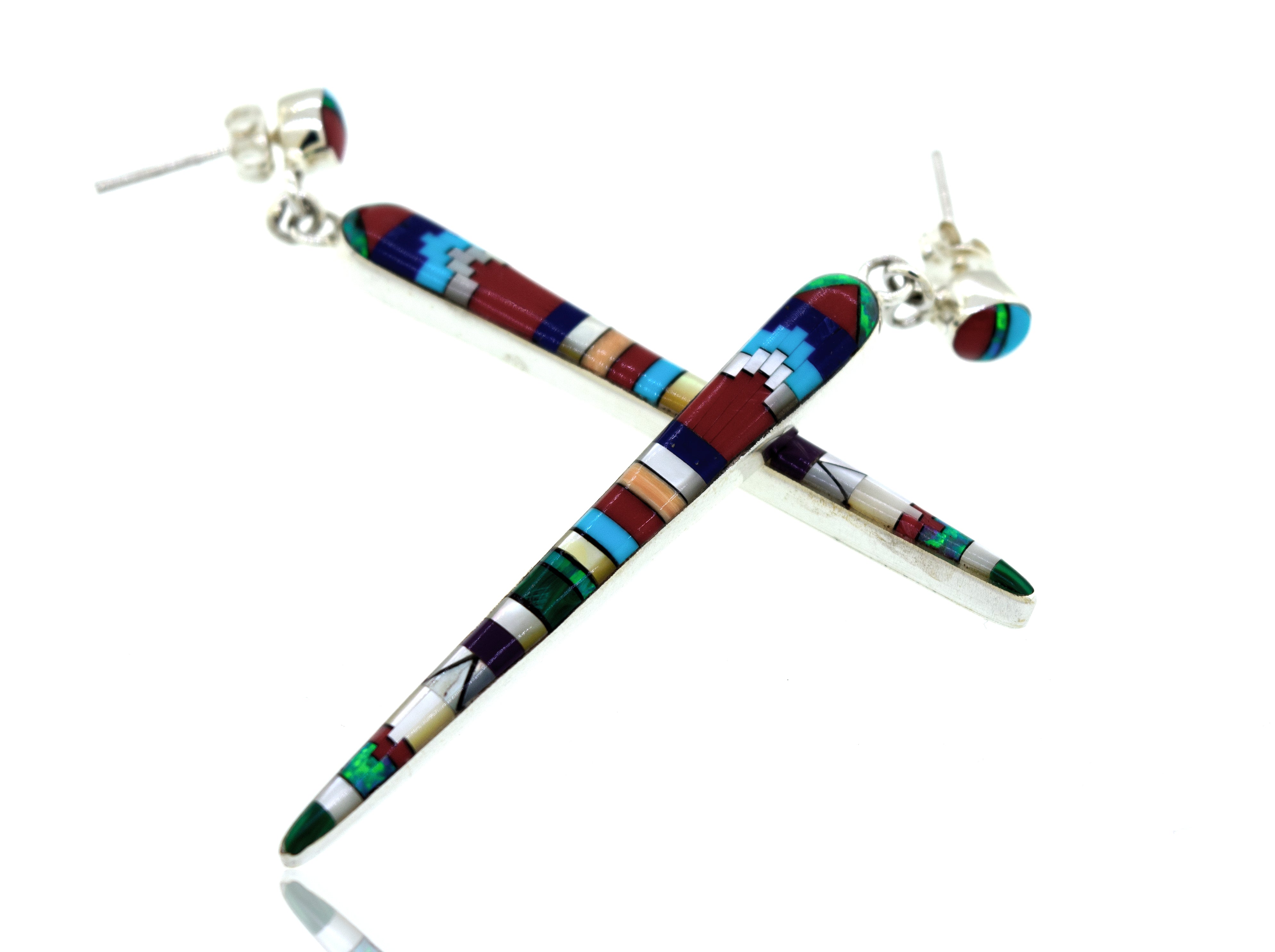 A pair of Super Silver beautiful designer multi-stone elongated teardrop earrings on a white background.