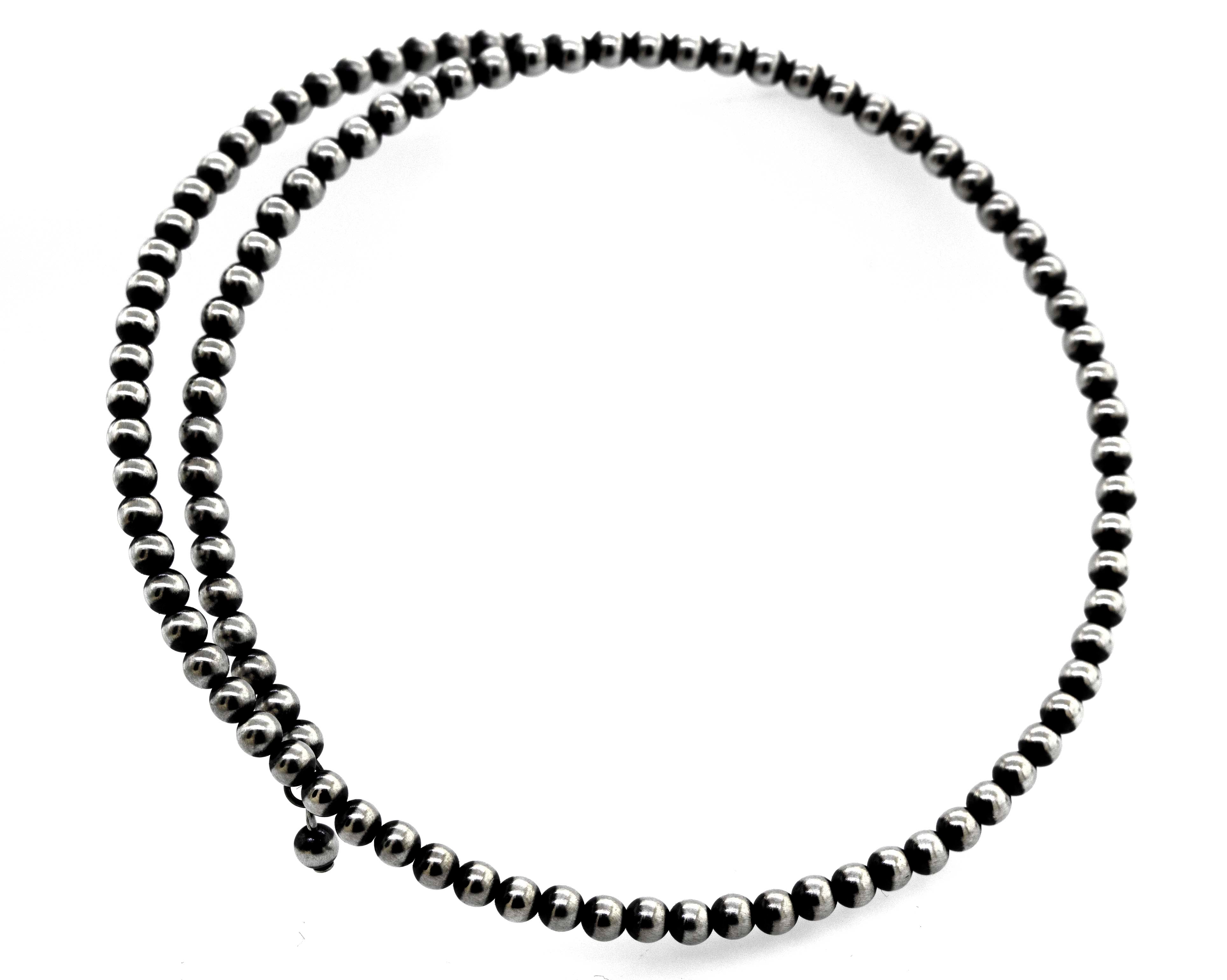 An edgy Super Silver Handcrafted Navajo Pearl Choker on a white background.