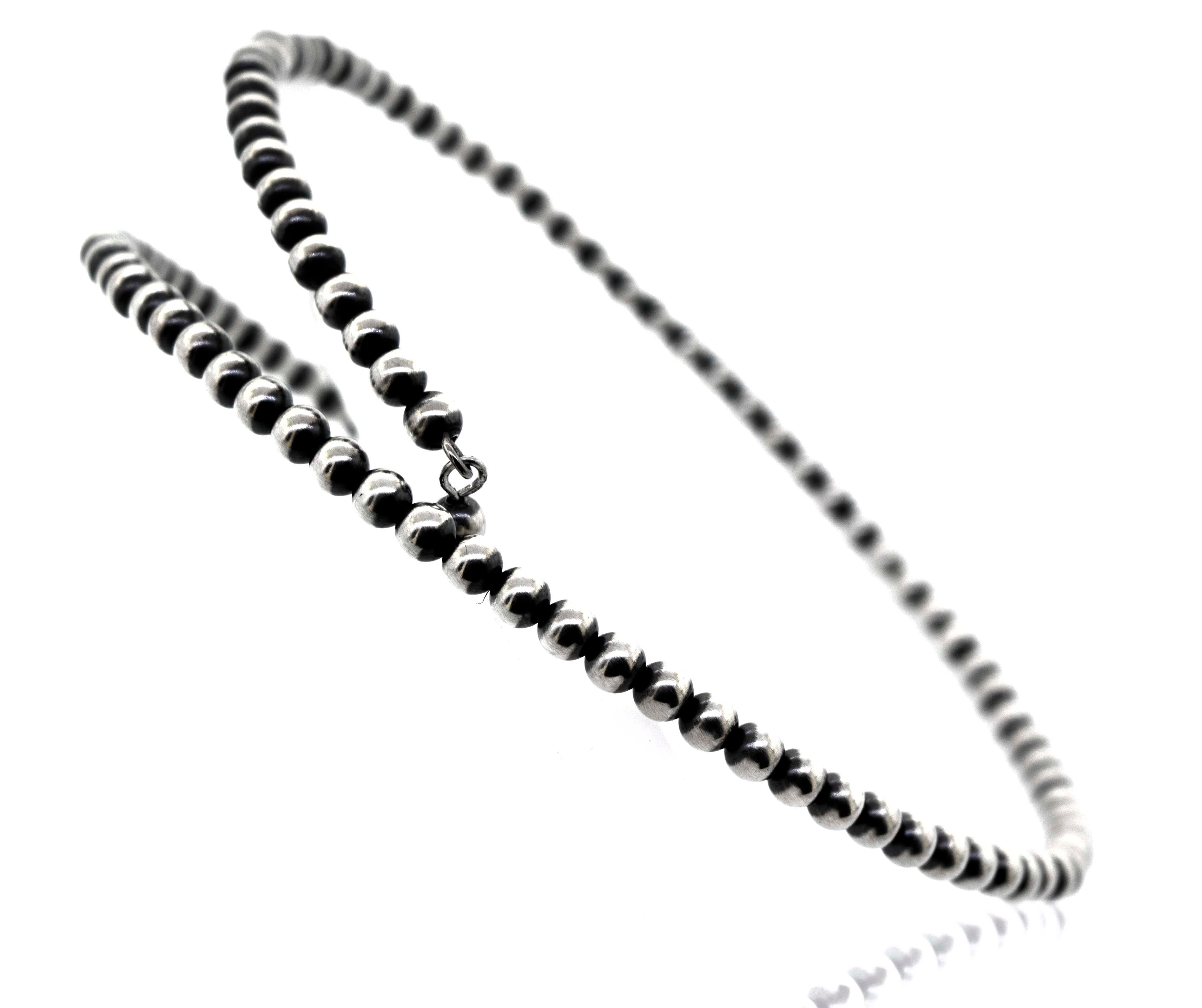 A rustic Super Silver Handcrafted Navajo Pearl Choker on a white background.