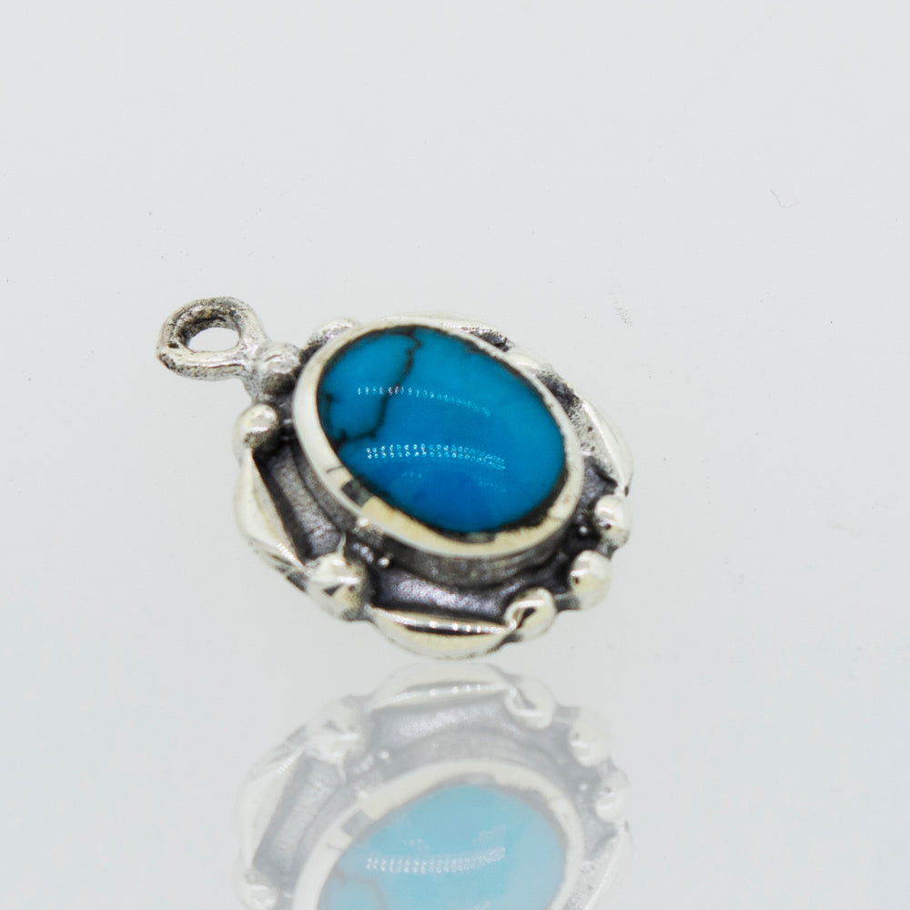 A Super Silver Beautiful Oval Stone pendant with a small oval turquoise stone.