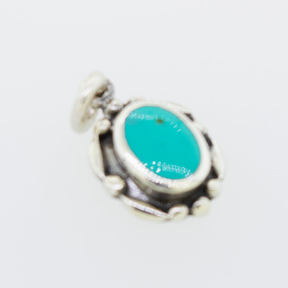 
                  
                    A small Beautiful Oval Stone Pendant With Silver Border from Super Silver with a turquoise stone.
                  
                